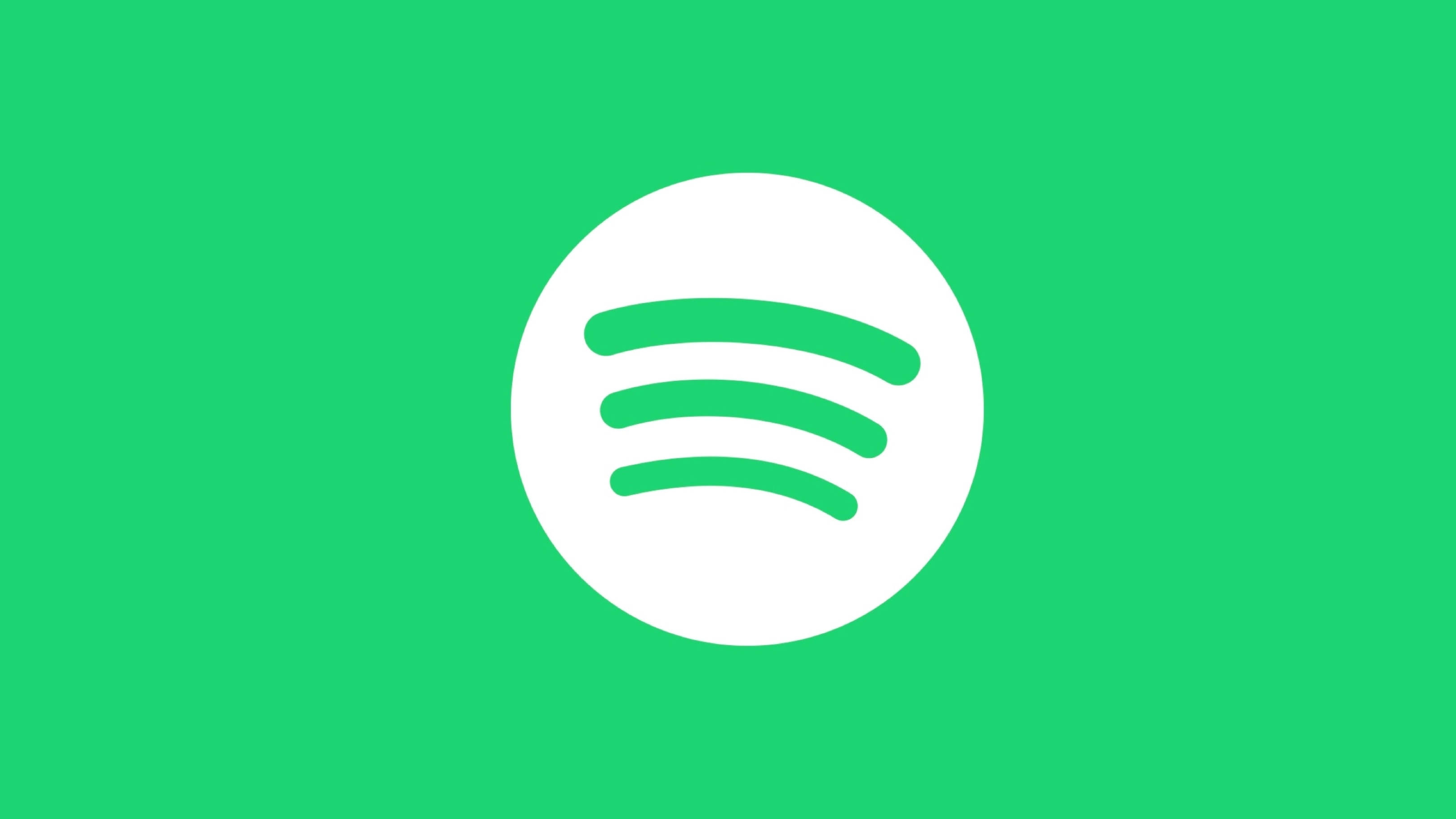 Spotify 桌布 壁紙 — 一個簡約的Spotify標誌，在純綠色背景上，白色圓圈內有三條綠色曲線。