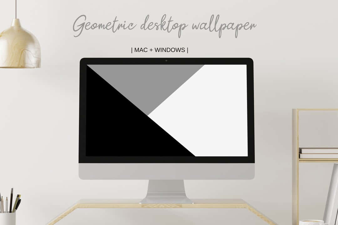 美感電腦 桌布 壁紙 — 一個簡約的桌面設置，配備一台時尚的 iMac，在柔和環境光下顯示大膽的黑、灰、白幾何壁紙。
