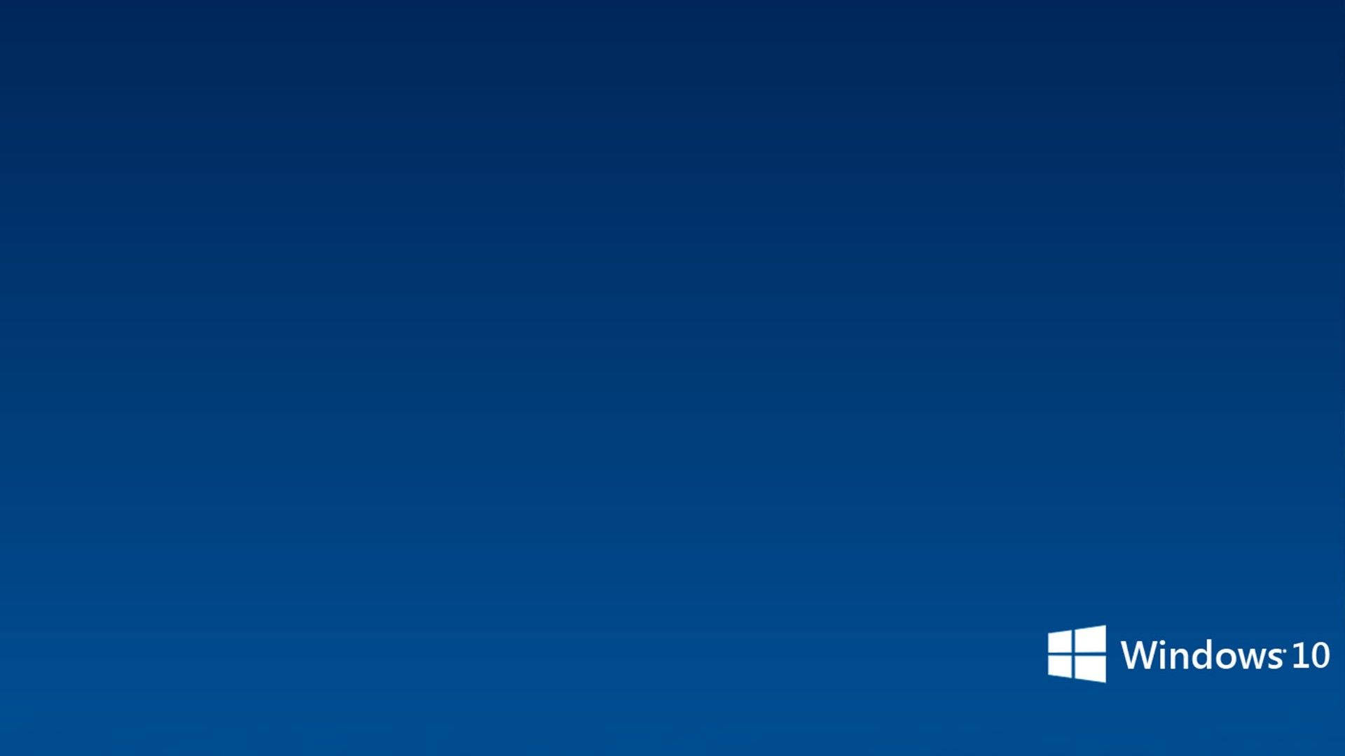 Windows 桌布 壁紙 — 一個簡約的漸變藍色背景，右下角有一個白色的 Windows 10 標誌。