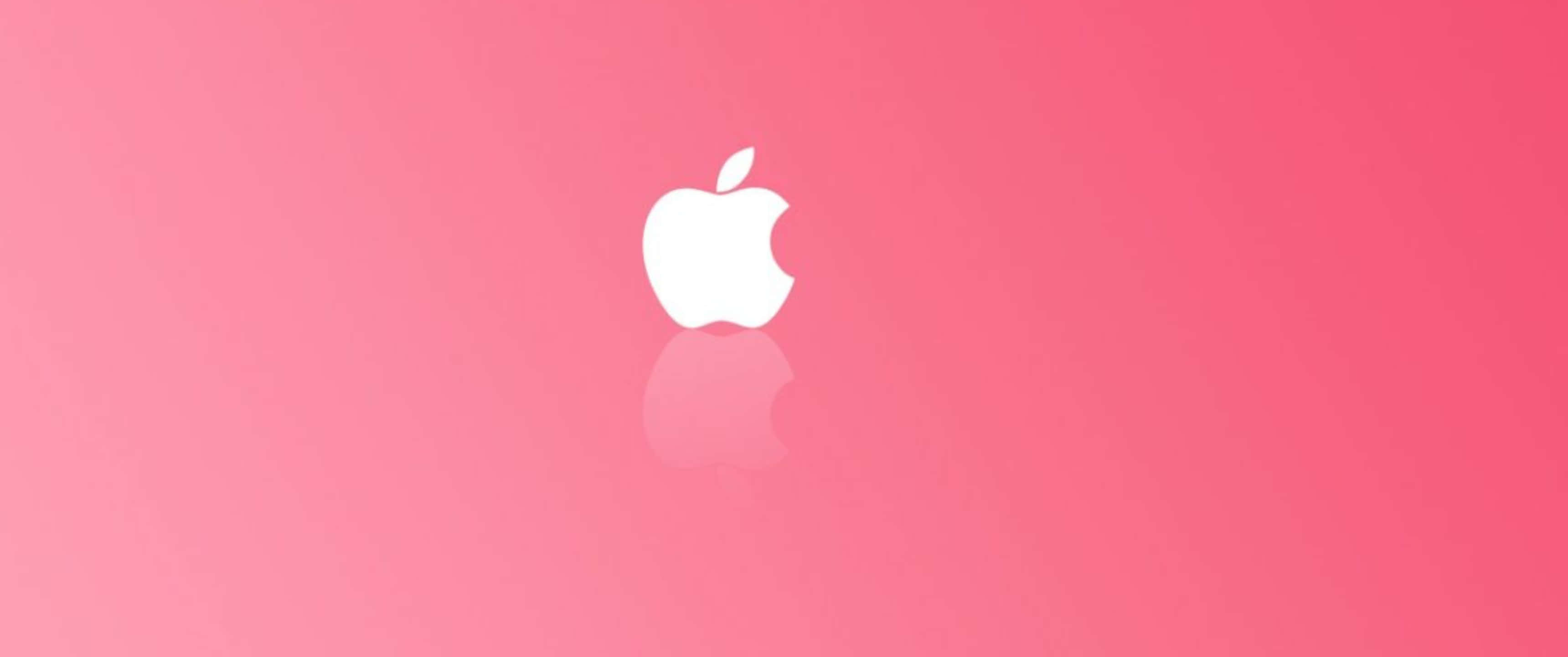 Pink Cute 桌布 壁紙 — 一個簡約的白色Apple標誌，帶有咬痕和倒影，居中在漸變粉紅色背景上。