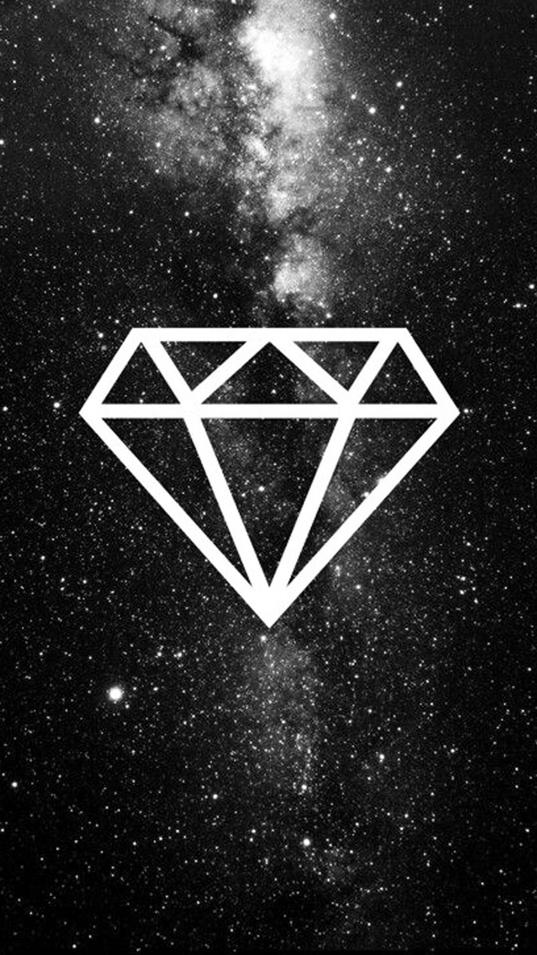 Diamond 桌布 壁紙 — 一個簡約的白色輪廓鑽石漂浮在滿天星斗的黑色銀河背景上。