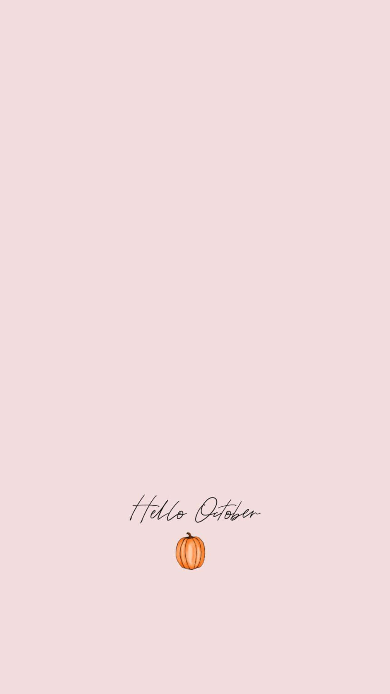 October Aesthetic 桌布 壁紙 — 一個簡約的蜜桃色背景，上面有文字「你好十月」和一個小橙色南瓜。