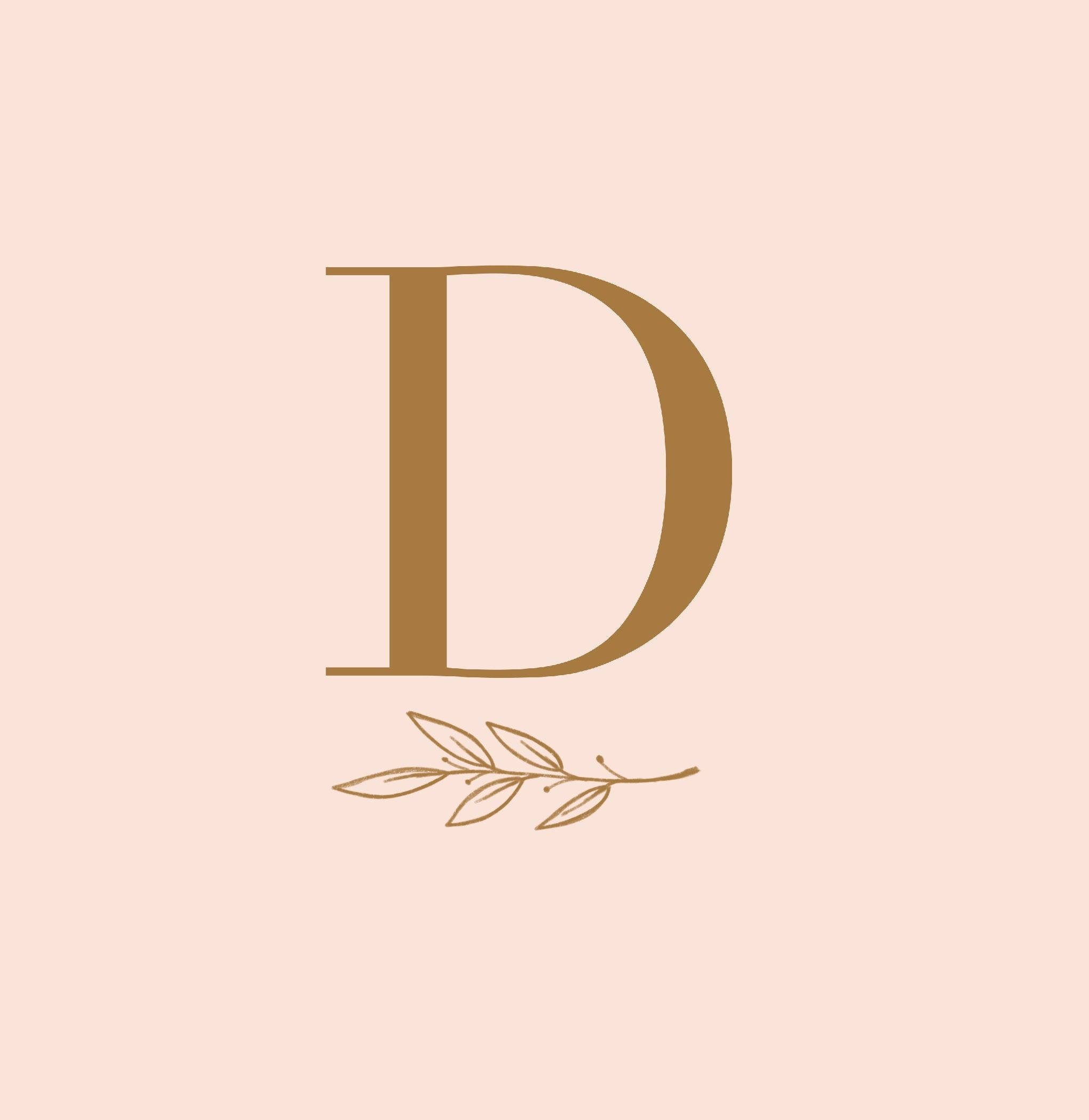 字母D 桌布 壁紙 — 一個簡約的金色字母 D，下方有月桂花環，背景為柔和蜜桃色。