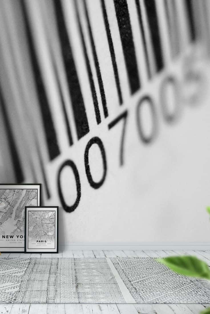 Barcode Scanning 桌布 壁紙 — 一個簡約風格的房間，特色是大型條碼壁紙，配上裱框的城市地圖靠牆擺放，前景有一片綠葉。