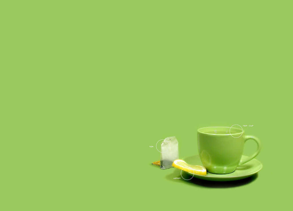 Green Minimalistic 桌布 壁紙 — 一個簡約風格的綠茶杯，搭配檸檬角和茶包，放在相配的碟子上，背景是純青檸綠色。