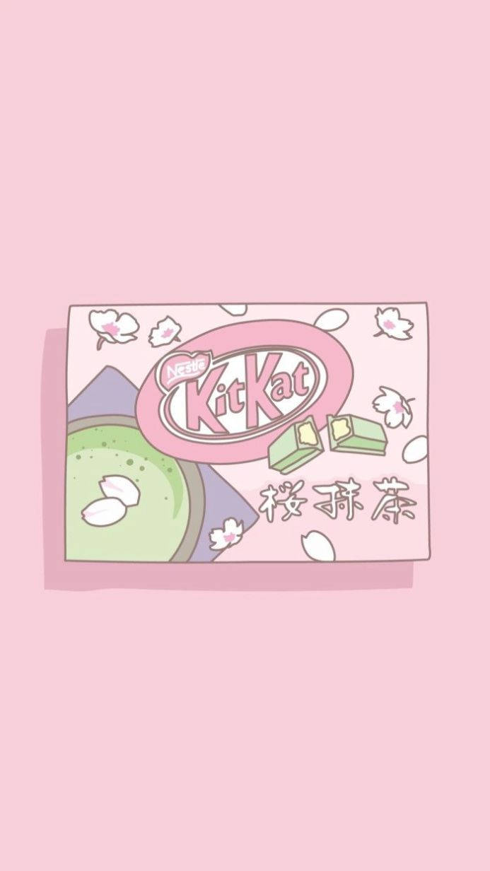 粉嫩美學 iPhone 桌布 壁紙 — 一個粉彩粉紅色插圖KitKat盒子，上面有抹茶綠茶和櫻花，背景是柔和的粉紅色。