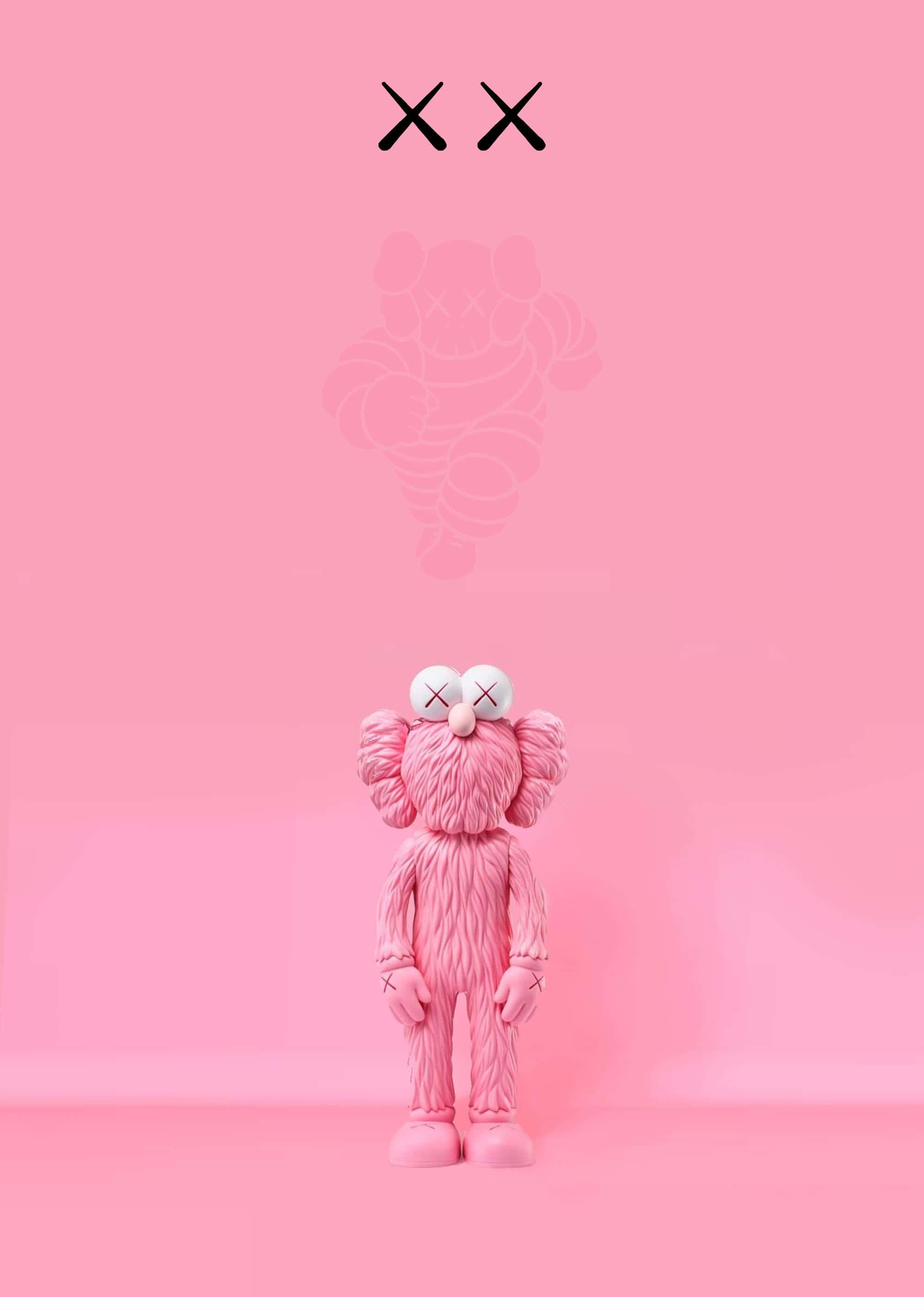 Kaws Bff Pink 桌布 壁紙 — 一個粉紅色的KAWS人偶站在純粉色背景前，其上方漂浮著一個半透明的幽靈般的自己。