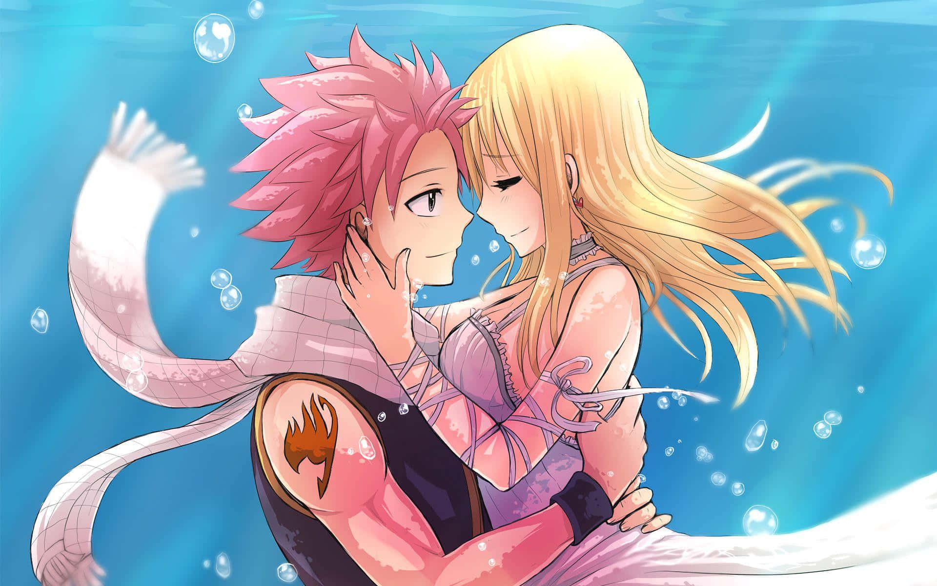 lucy heartfilia 桌布 壁紙 — 一個粉紅色頭髮的動漫男孩和一個金髮女孩在水下溫柔地擁抱，氣泡在他們周圍飄浮，背景是寧靜的藍色海洋場景。