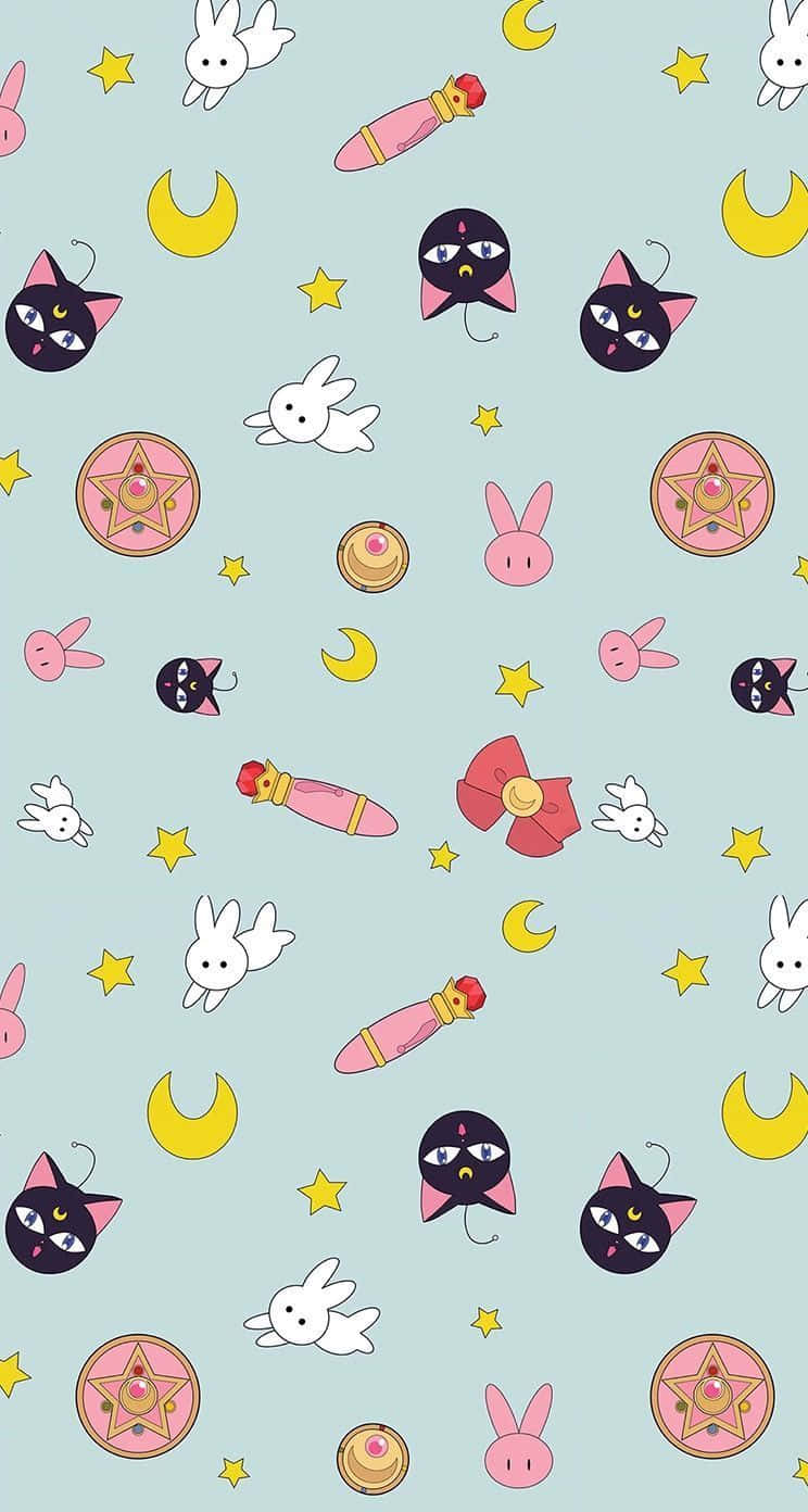 Sailor Moon Pattern 桌布 壁紙 — 一個粉藍色壁紙圖案，上面散落著可愛的卡通貓咪、兔子、星星和魔法物品。
