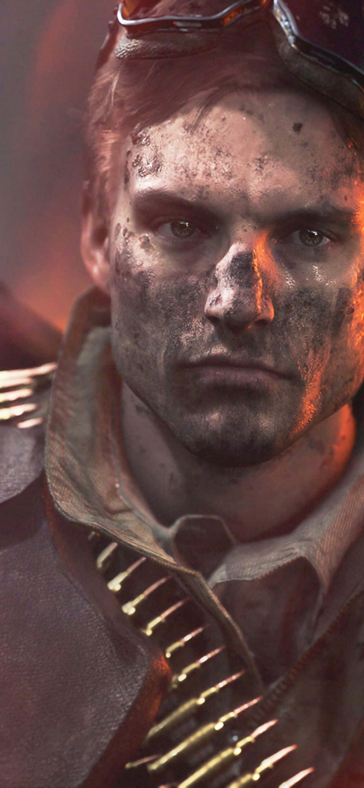 iPhone Xs Max Battlefield V 桌布 壁紙 — 一個粗糙的特寫鏡頭，展示一名經歷戰鬥的士兵，臉上沾滿泥巴，胸前掛著子彈帶，在溫暖的橙色燈光下。