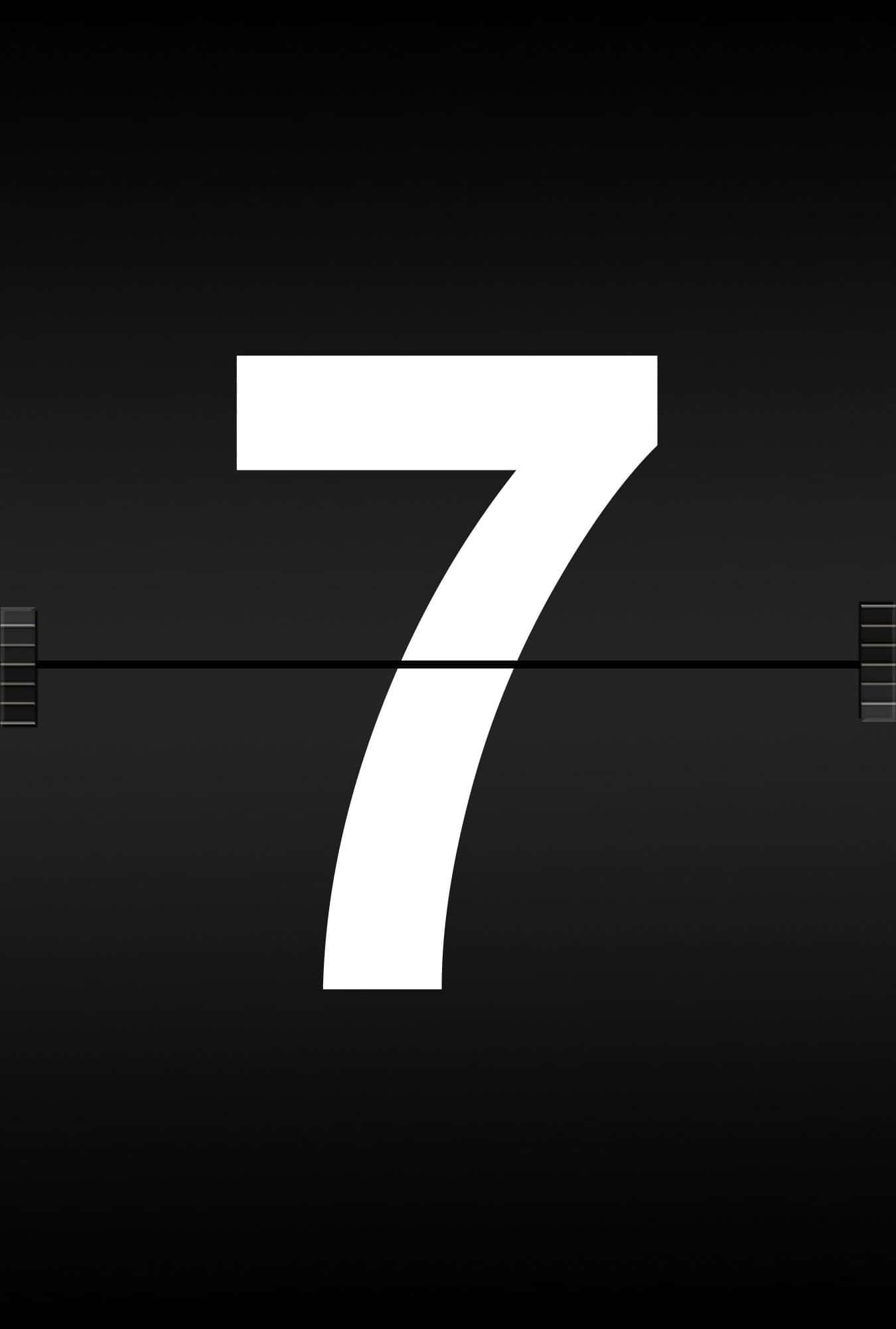 Number 7 桌布 壁紙 — 一個粗體白色數字七居中在深色漸變背景上，兩側有膠卷標記。