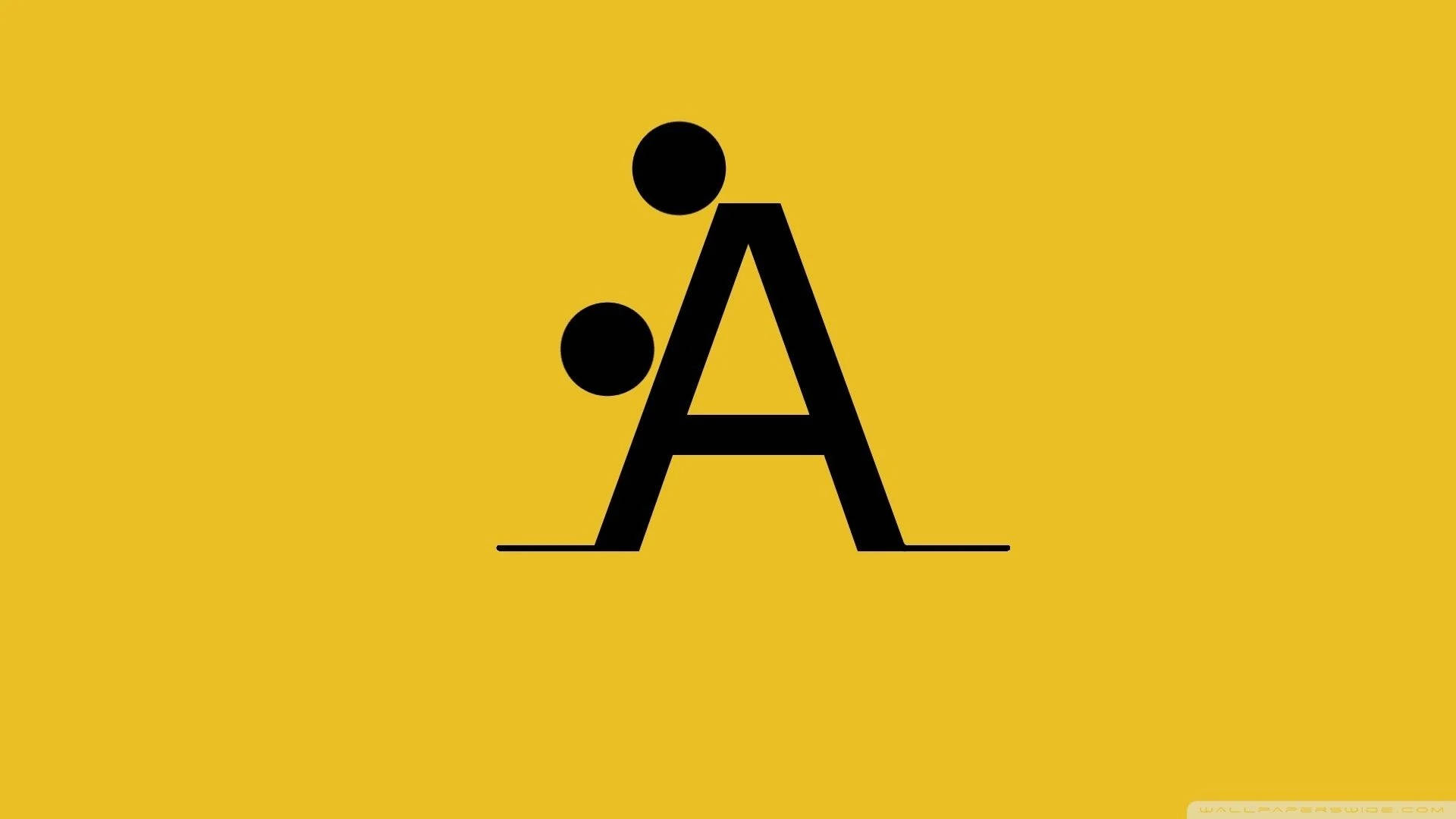 Letter A 桌布 壁紙 — 一個粗體黑色字母A，帶有兩個圓圈，在純黃色背景上形成一個風格化的人形。