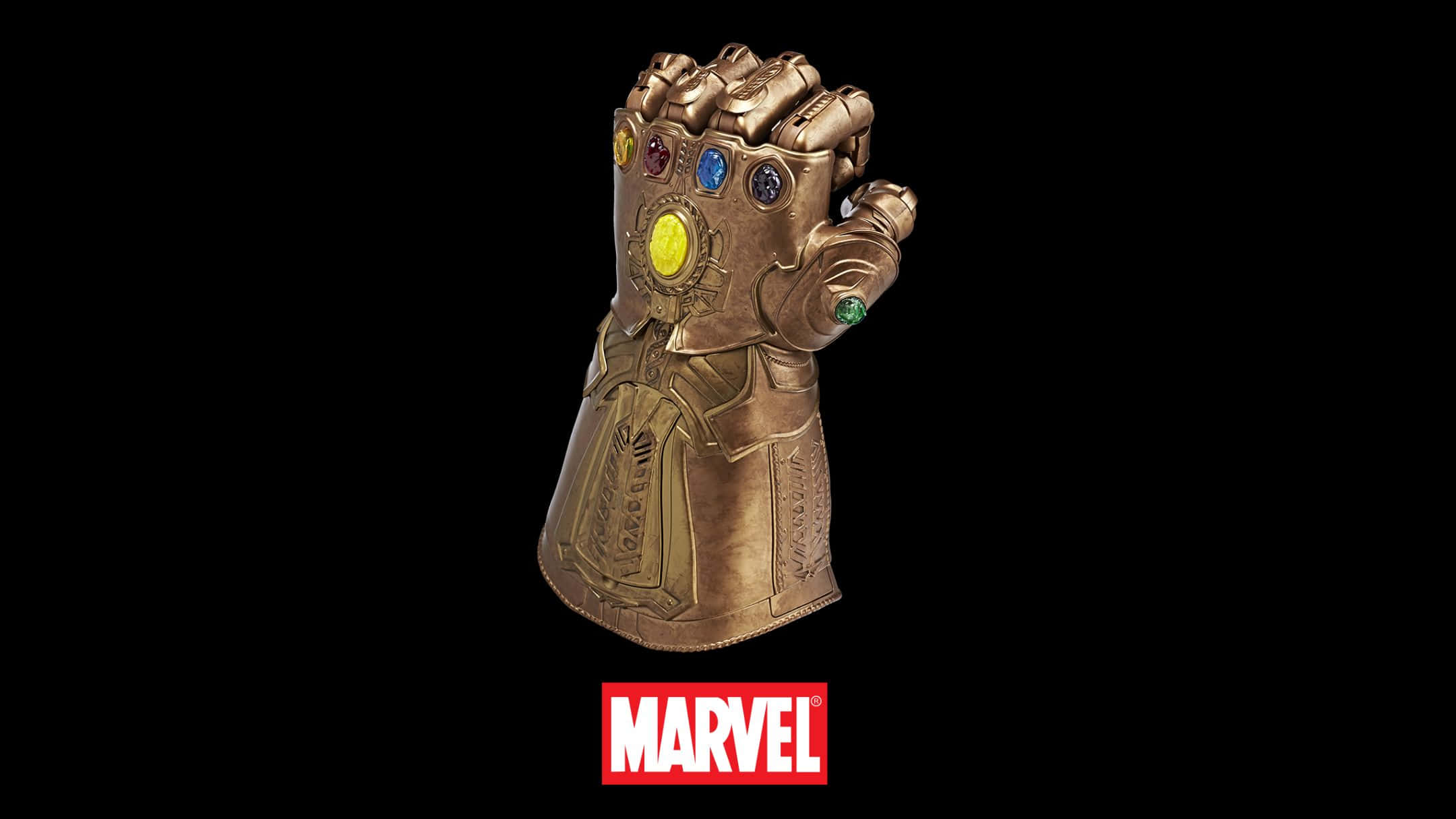 Best Marvel 桌布 壁紙 — 一個精細的金色無限手套，鑲有六顆色彩繽紛的寶石，置於黑色背景上，並帶有Marvel標誌。