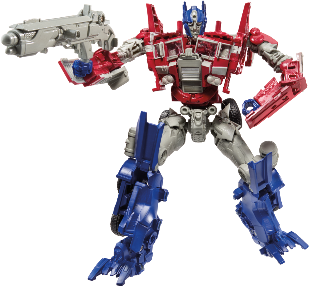 變形金剛 桌布 壁紙 — 一個紅色、藍色和銀色的柯博文（Optimus Prime）動作人偶在黑色背景前動態地站立，手持一把大槍。