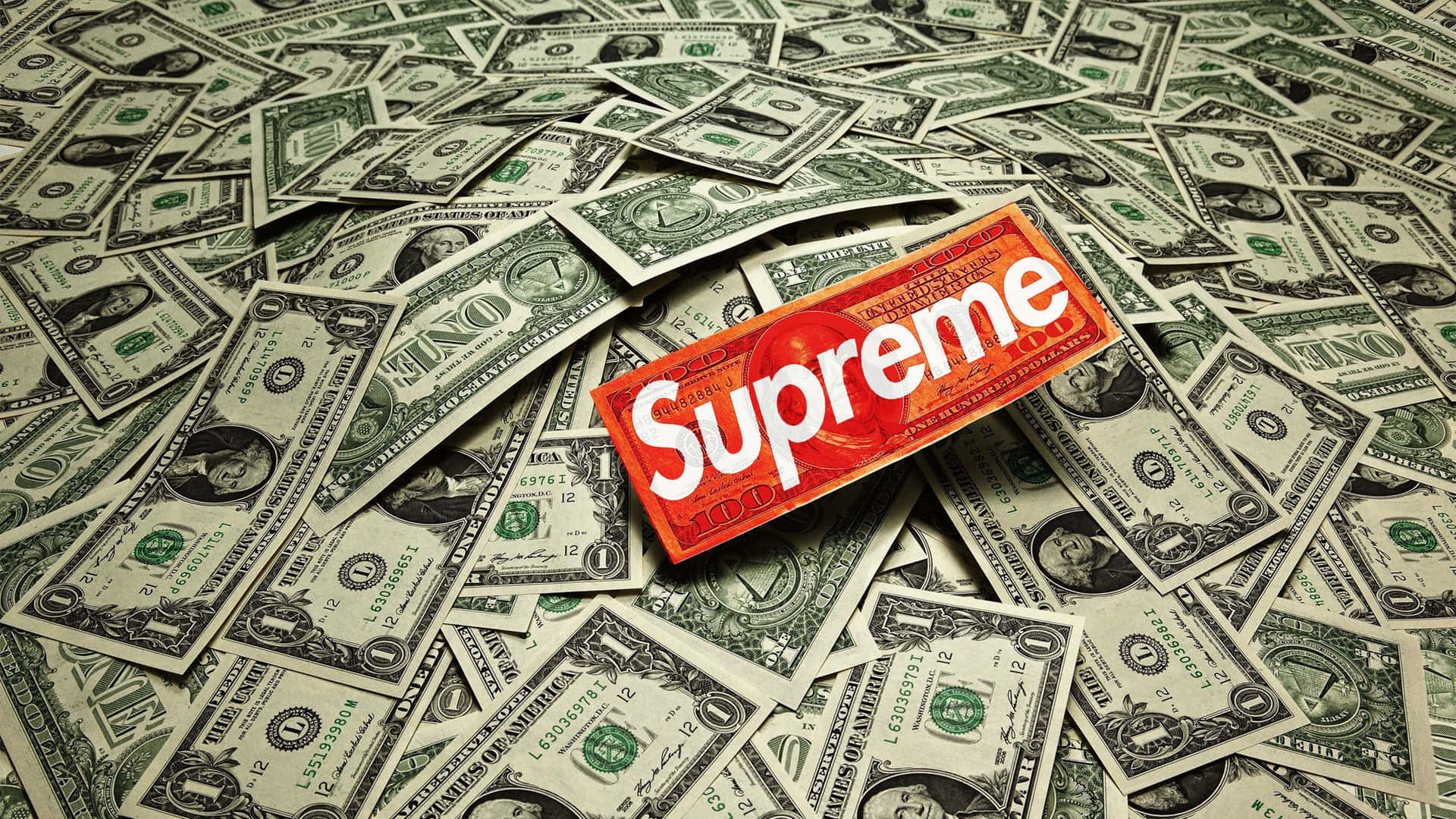 紅色Supreme盒子被散落的一美元鈔票包圍。 — Supreme GIF 壁紙