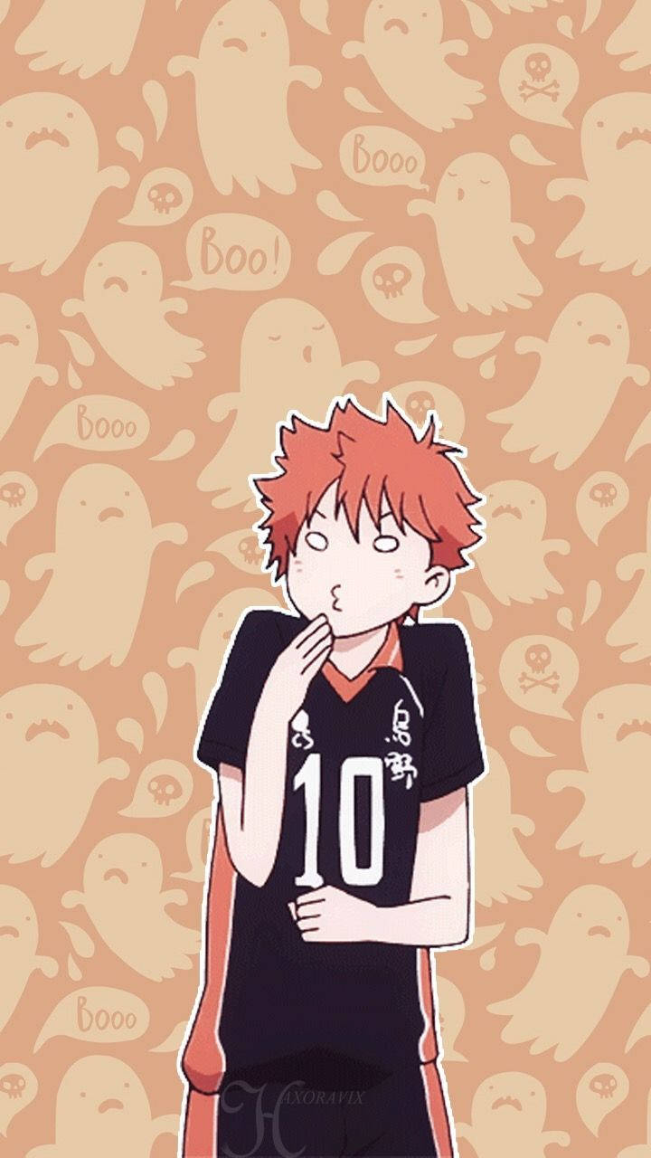 排球少年 桌布 壁紙 — 一個紅髮動漫男孩穿著黑色排球球衣，號碼10，站在一個充滿鬼魂和骷髏的桃色背景前。