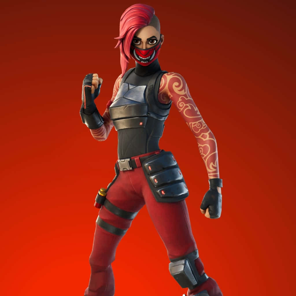 Powerful 桌布 壁紙 — 一個紅髮戴面具的兇猛女性Fortnite角色在純紅色背景前擺出戰鬥姿勢。