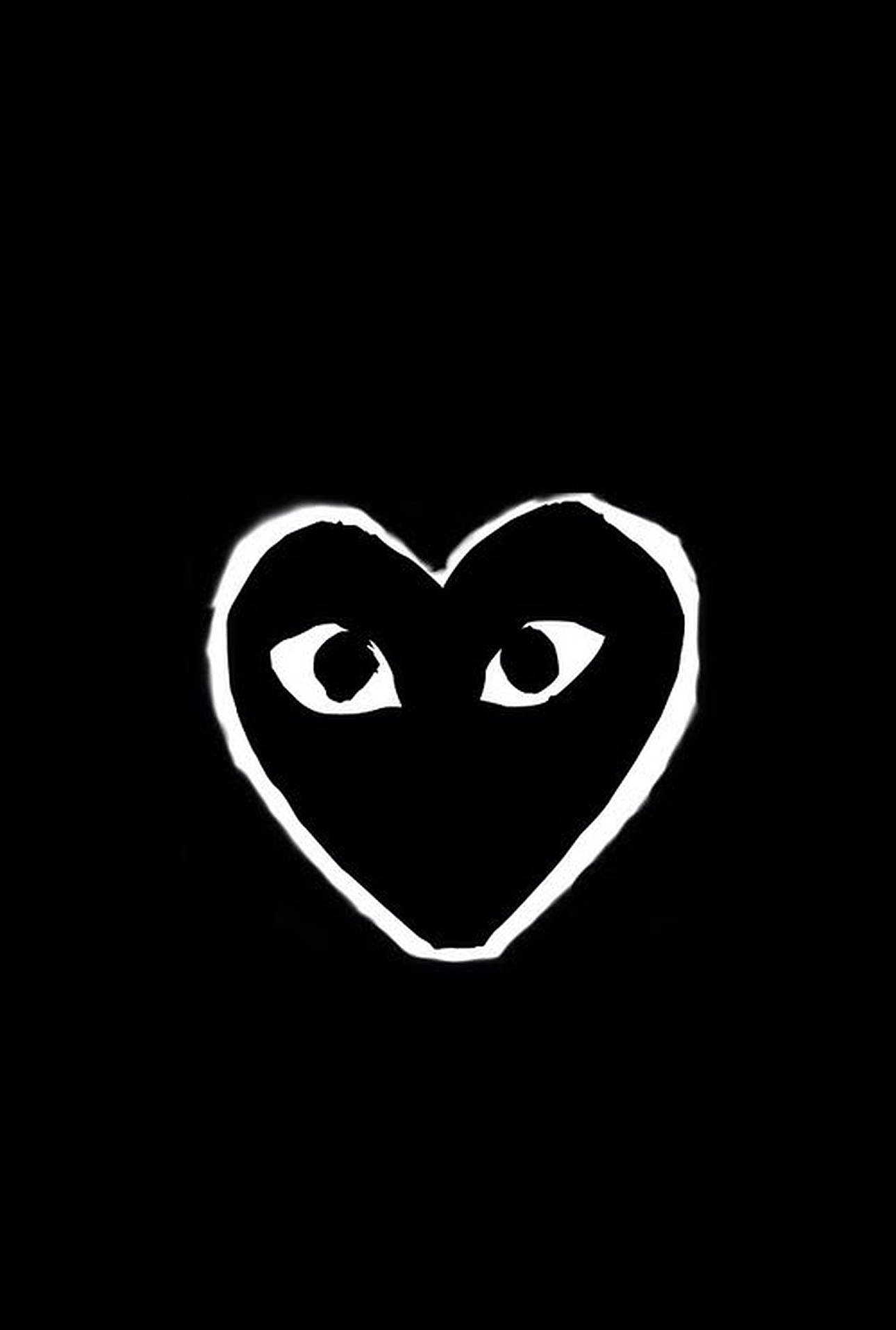 cdg 桌布 壁紙 — 一個純白色心形，帶有發光的眼睛，在純黑色背景上凝視。
