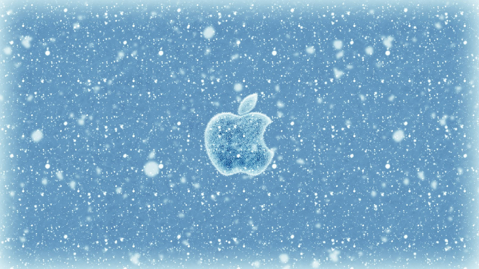 結霜的Apple標誌在飄雪中，藍色背景
