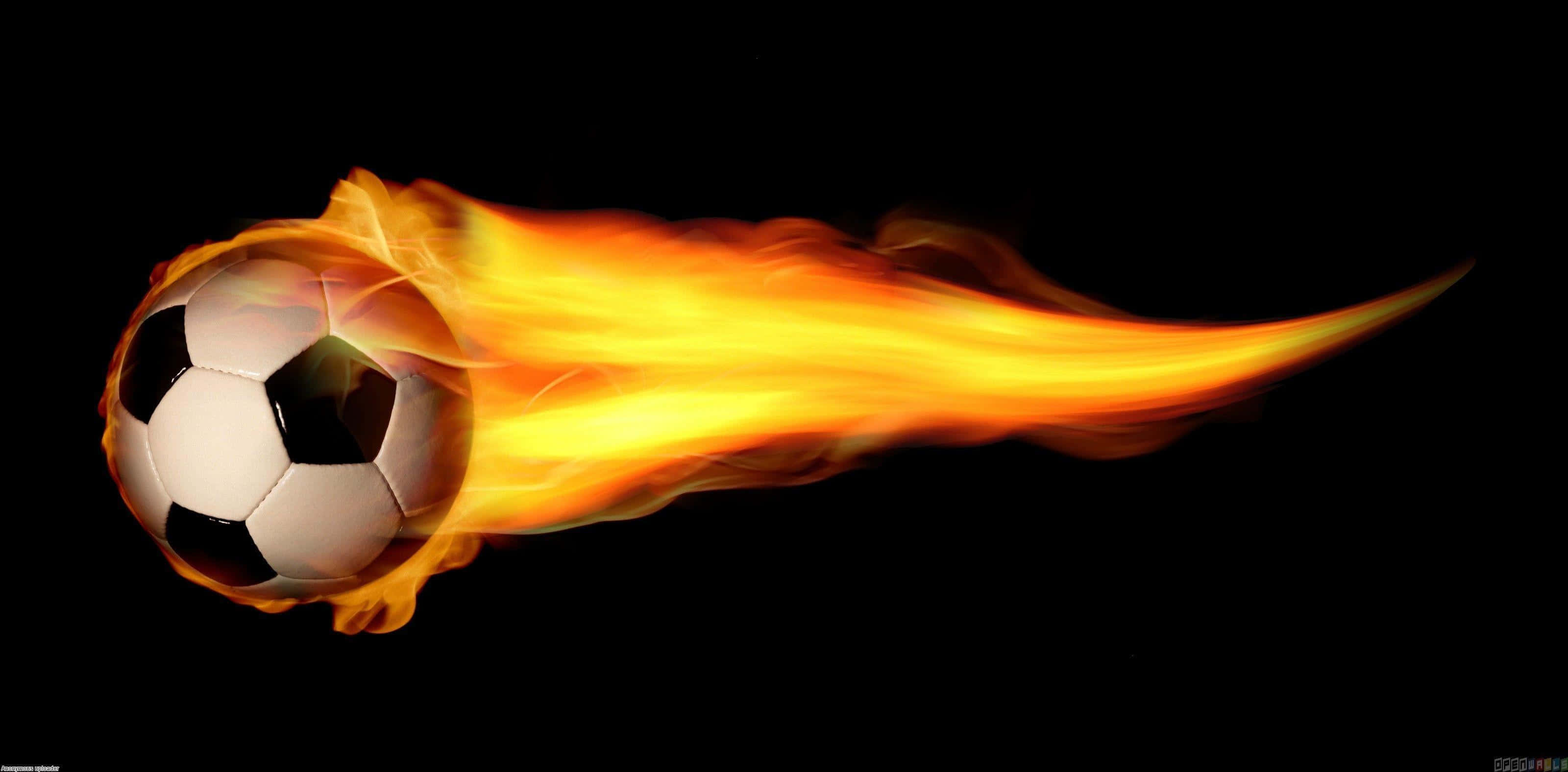 Football On Fire 桌布 壁紙 — 一個經典足球被鮮豔的橙色火焰吞噬，在純黑背景上劃過。