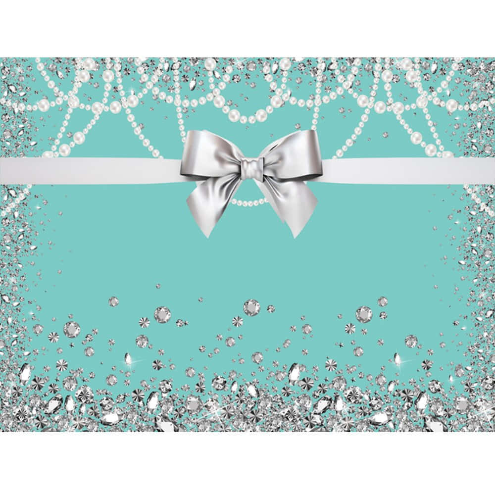 Tiffany Blue 桌布 壁紙 — 一個綠松石背景，裝飾有銀色閃粉鑽石、珍珠和一個位於白色絲帶中央的大緞帶蝴蝶結。