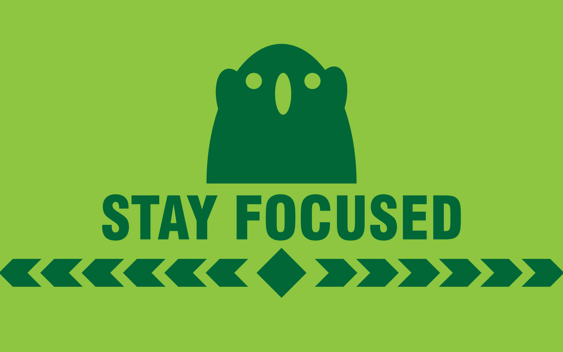 綠色鬼魂圖標位於文字 stay focused 上方，下方有箭頭圖案。 — 勵志動圖 壁紙