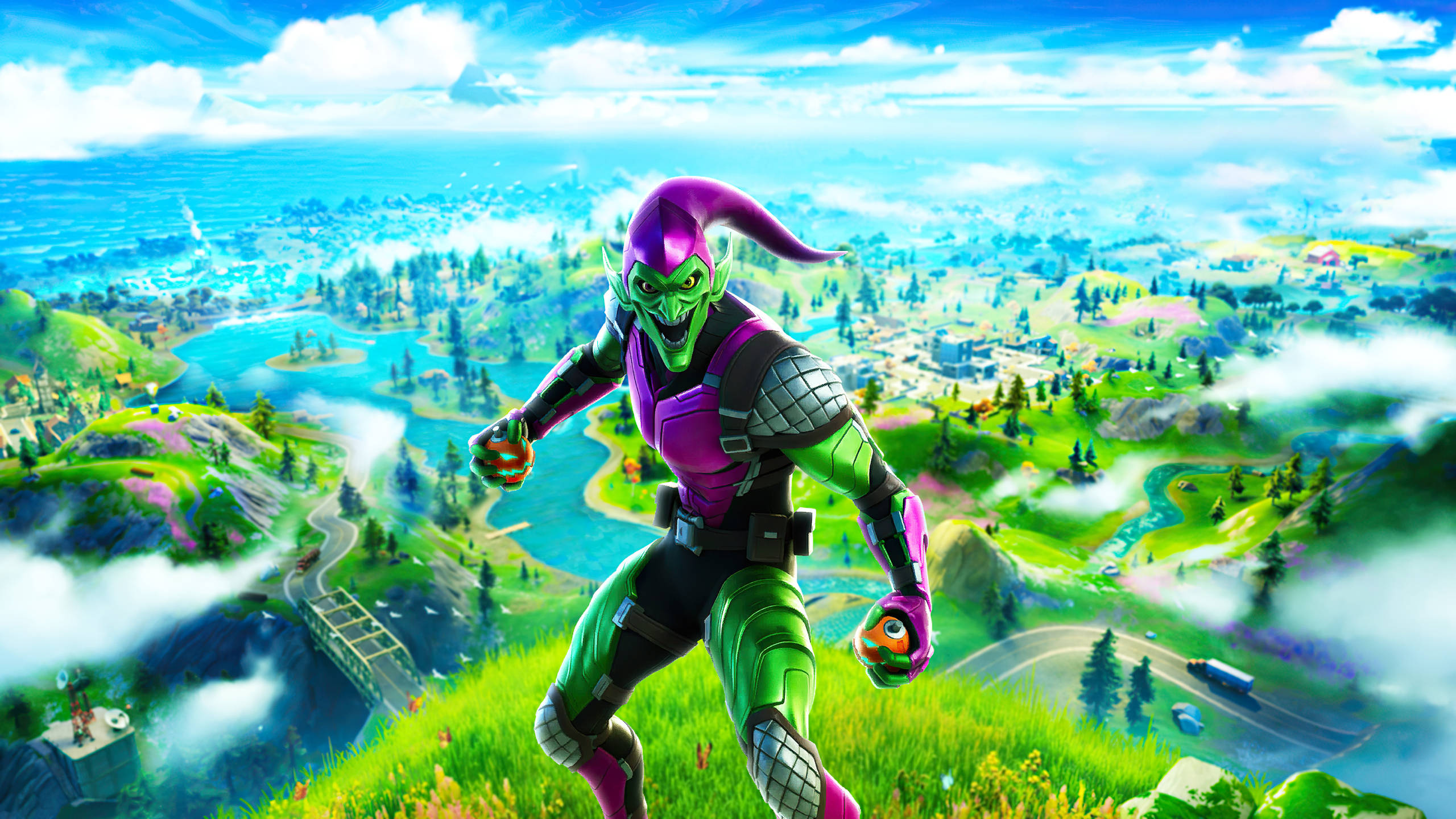 Fortnite 桌布 壁紙 — 一個綠色皮膚的小丑穿著紫色和綠色的盔甲，在長滿草的山崖上跳躍，俯瞰著一個充滿活力的卡通風格島嶼景觀。