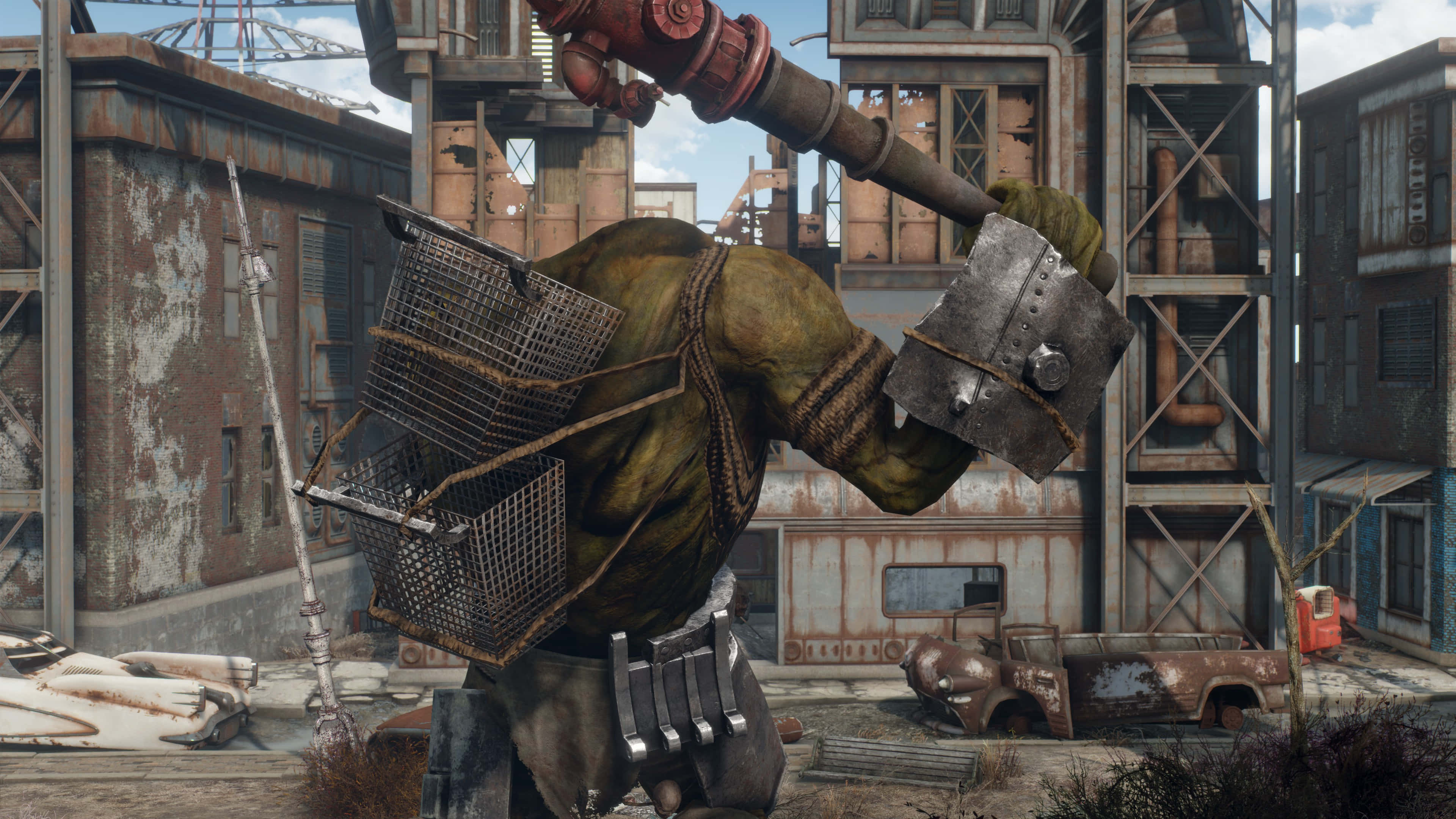 Fallout 4 The Capital Wasteland 桌布 壁紙 — 一個綠色皮膚的變種人在破敗的工業廢墟中揮舞著巨大的管道錘，周圍是生鏽的建築物和廢棄的車輛。
