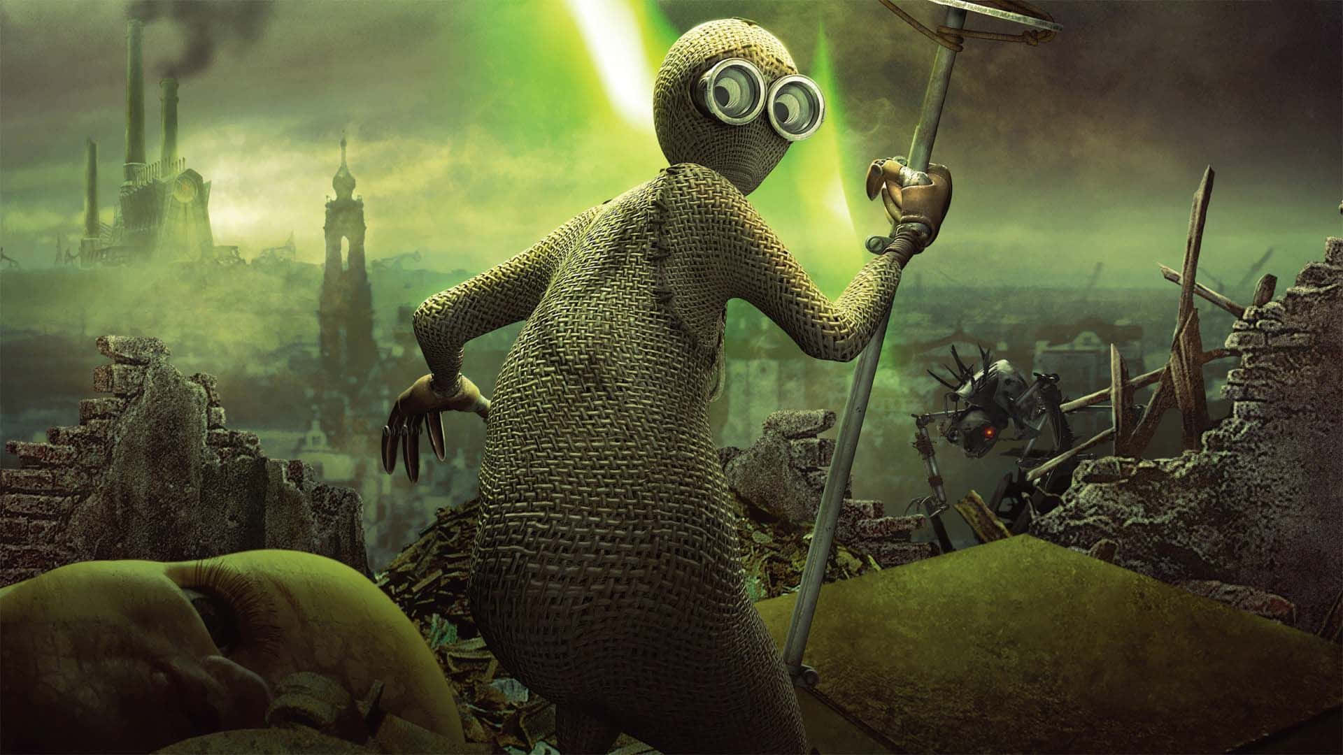 電影動圖 桌布 壁紙 — 一個編織的人形生物戴著護目鏡，站在廢墟城市景觀中，綠色發光的天空下，手持一根桿子。