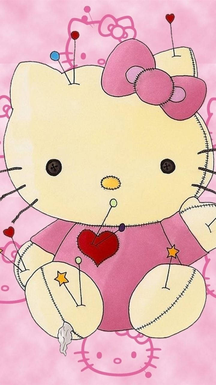 可愛女生 桌布 壁紙 — 一個縫製的Hello Kitty毛絨玩具，身上有別針穿過，胸前有一個紅色心形，背景為粉紅色。