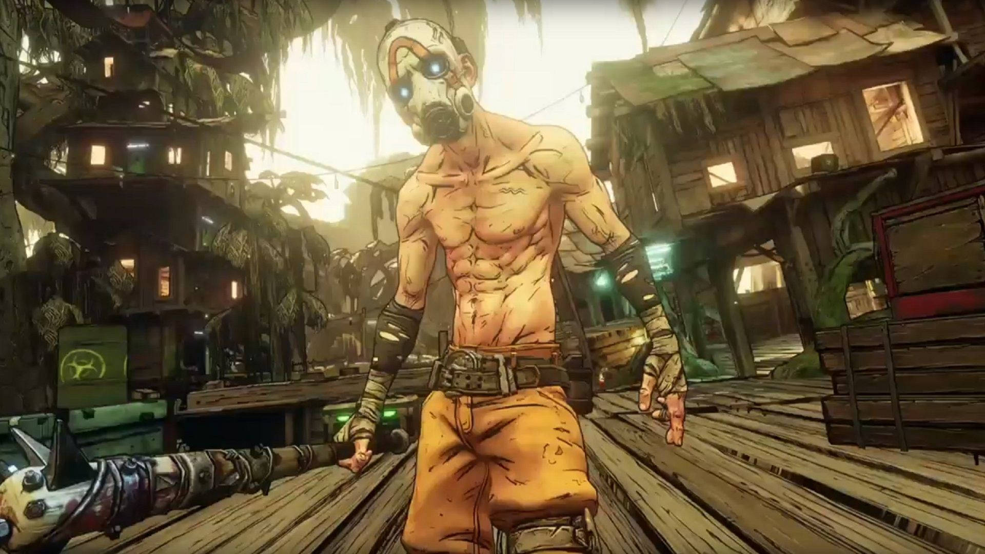 Borderlands 3 桌布 壁紙 — 一個肌肉發達、戴著面具的戰士站在破舊叢林村莊的木製平台上，眼睛發光，手持武器。