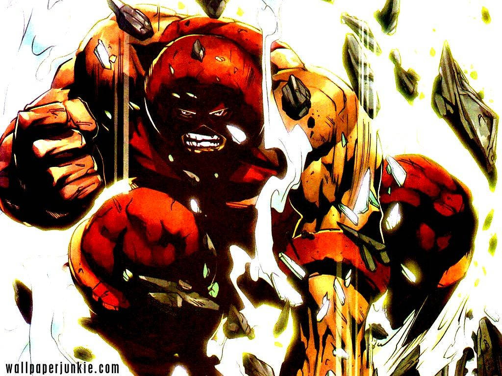 Juggernaut 桌布 壁紙 — 一個肌肉發達、紅皮膚、眼睛發光、身穿鋸齒盔甲的超級英雄，在動態漫畫面板中衝破牆壁。