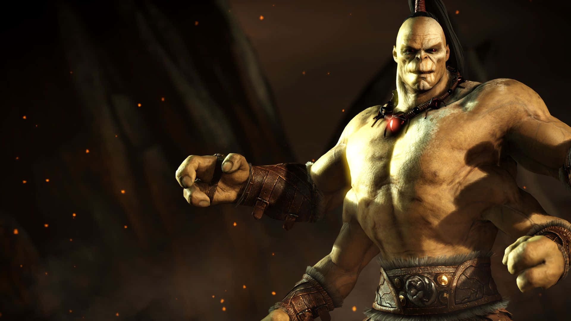 Mortal Kombat Goro 桌布 壁紙 — 一個肌肉發達的光頭戰士，穿著部落裝備，眼睛發光，站在熾熱的黑暗競技場中準備戰鬥。