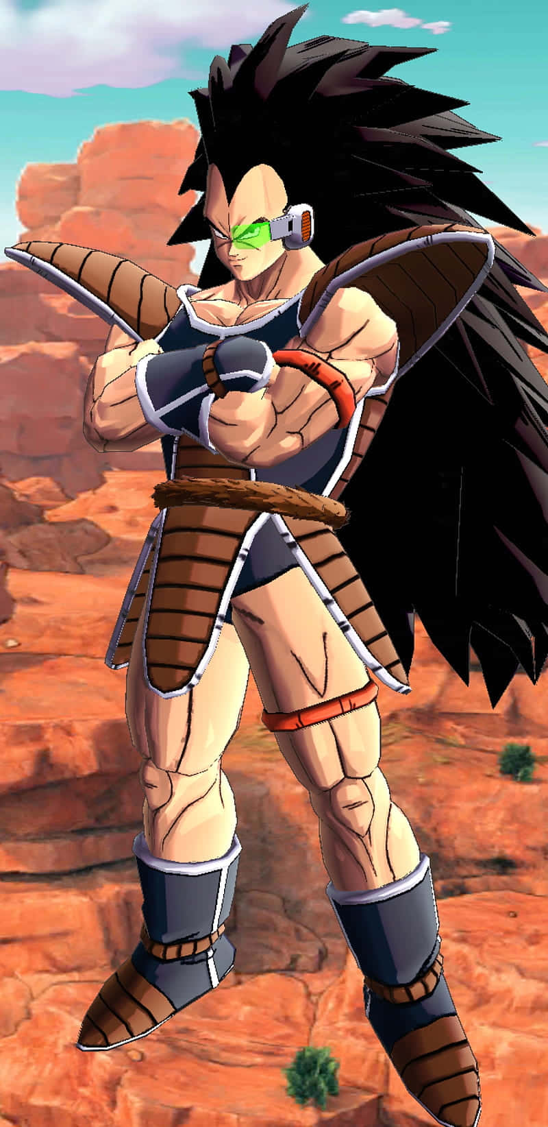 Raditz 桌布 壁紙 — 一個肌肉發達的動漫戰士，擁有尖刺黑髮和綠色發光的眼睛，站在沙漠峽谷中，穿著棕色和藍色的盔甲。