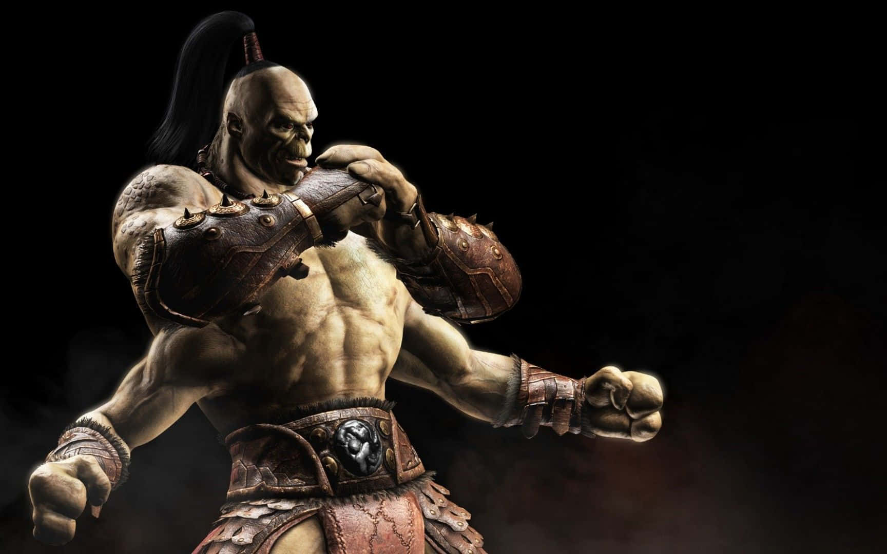 Mortal Kombat Goro 桌布 壁紙 — 一個肌肉發達的戰士，擁有骷髏般的面孔和尖刺盔甲，在黑暗煙霧的背景中向前猛衝。