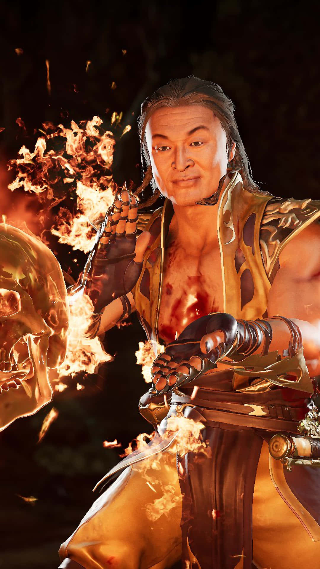 Mortal Kombat Shang Tsung 桌布 壁紙 — 一個肌肉發達的戰士穿著金色盔甲，在黑暗背景下從手中釋放火焰能量。
