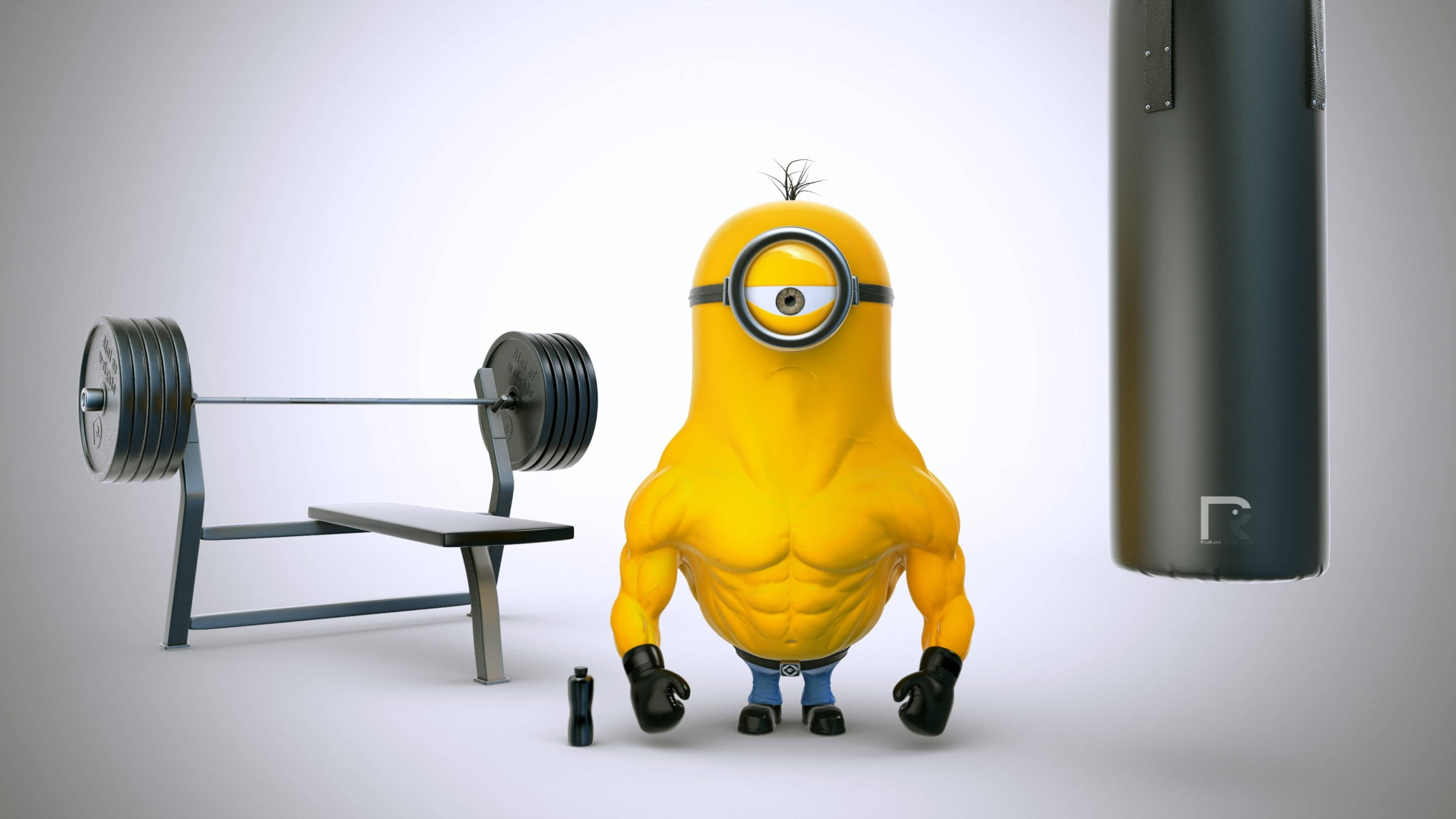 健身房 桌布 壁紙 — 一個肌肉發達的黃色Minion自豪地站在健身房裡，旁邊有槓鈴凳和沙包。
