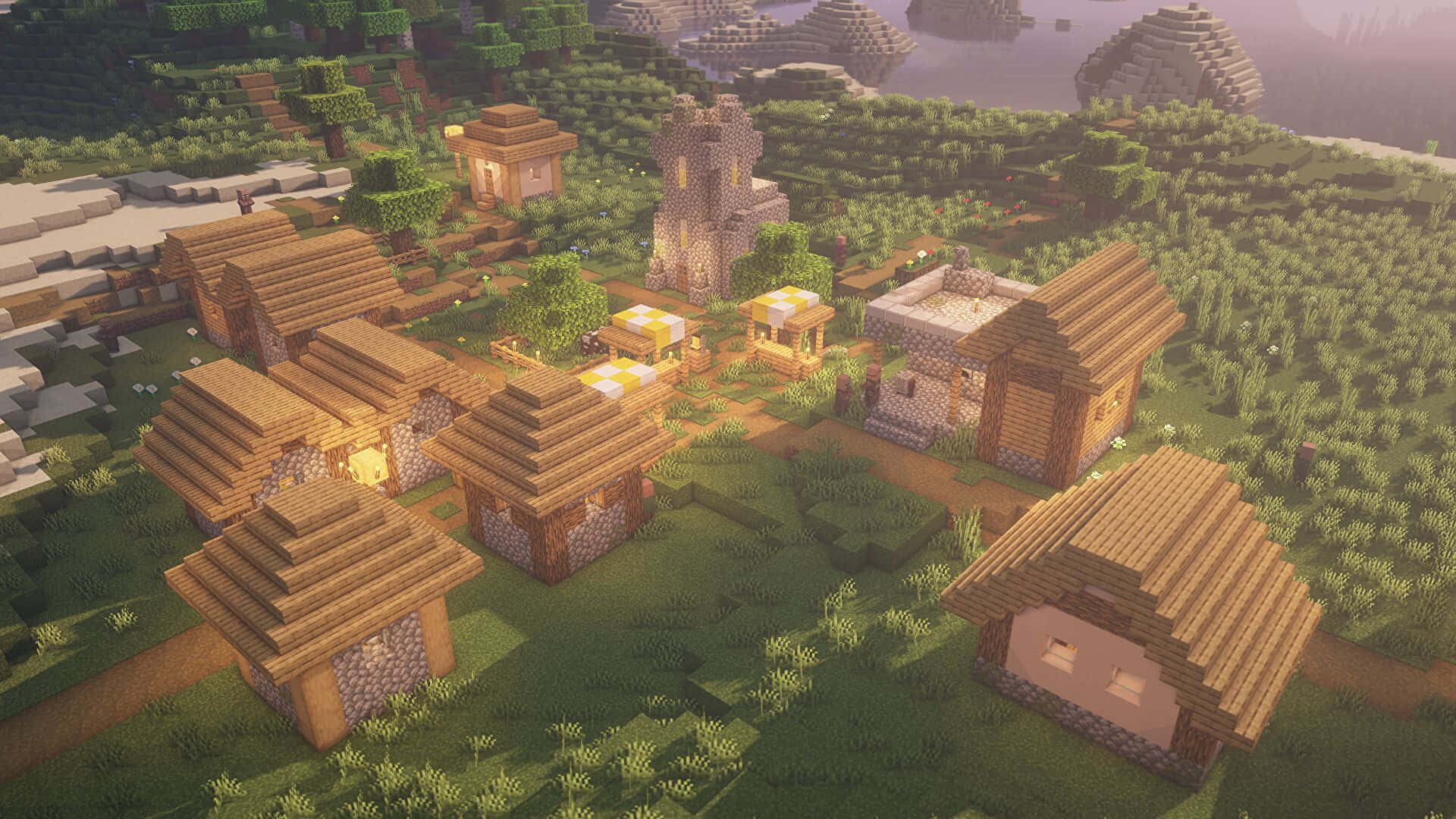Village 桌布 壁紙 — 一個舒適的Minecraft村莊，有木屋和石塔，坐落在黃金時段的草地山谷中。