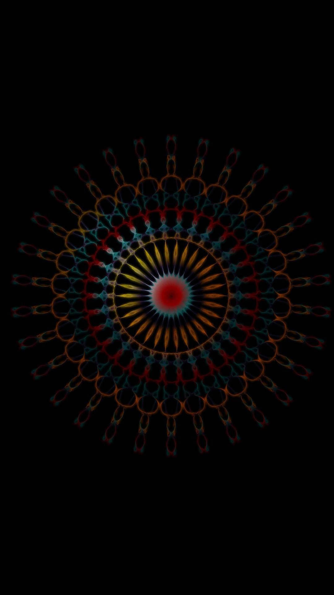 Aesthetic Trippy 桌布 壁紙 — 一個色彩繽紛、帶有複雜幾何圖案的發光曼陀羅，在純黑色背景上閃耀。