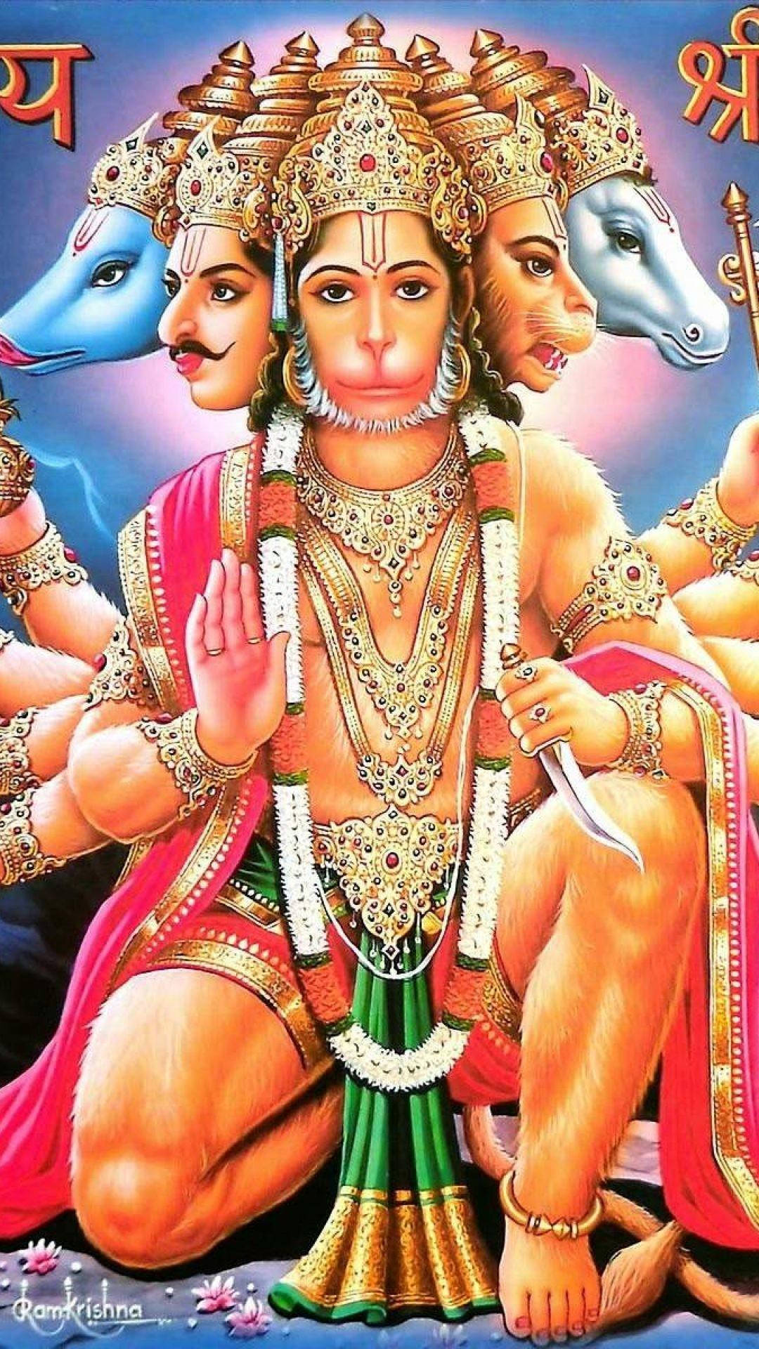 hanuman art 桌布 壁紙 — 一個色彩鮮豔的插圖神祇，有多個頭和手臂，飾有黃金首飾和彩色服裝，以莊嚴的姿勢坐著。