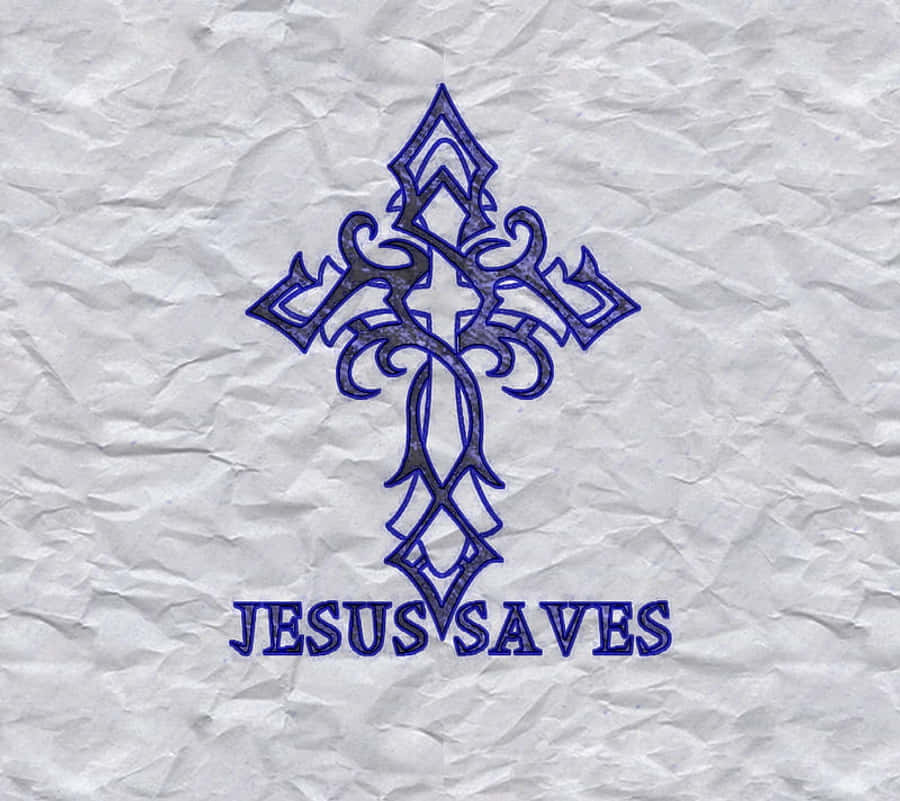 Jesus Saves 桌布 壁紙 — 一個華麗的藍色十字架，上面有「JESUS SAVES」文字，畫在皺巴巴的白紙上。