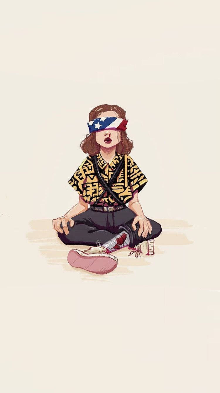 Aesthetic Stranger Things Eleven 桌布 壁紙 — 一個蒙眼女孩穿著圖案襯衫，盤腿坐在普通地板上，脫了一隻鞋。