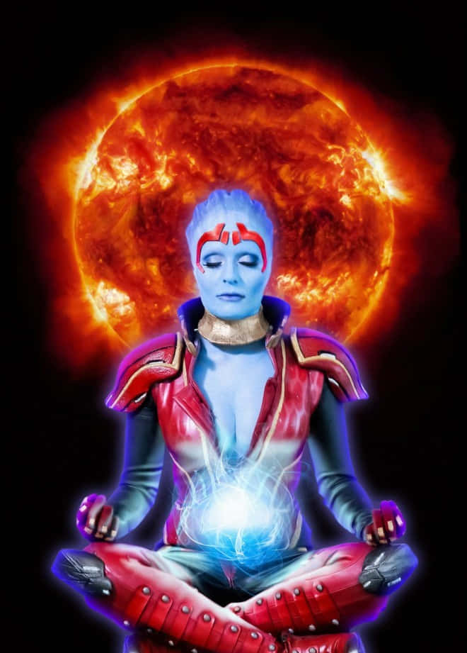Mass Effect Samara 桌布 壁紙 — 一個藍皮膚外星人盤腿坐在熾熱的橙色太陽前冥想，核心有發光的能量旋轉。