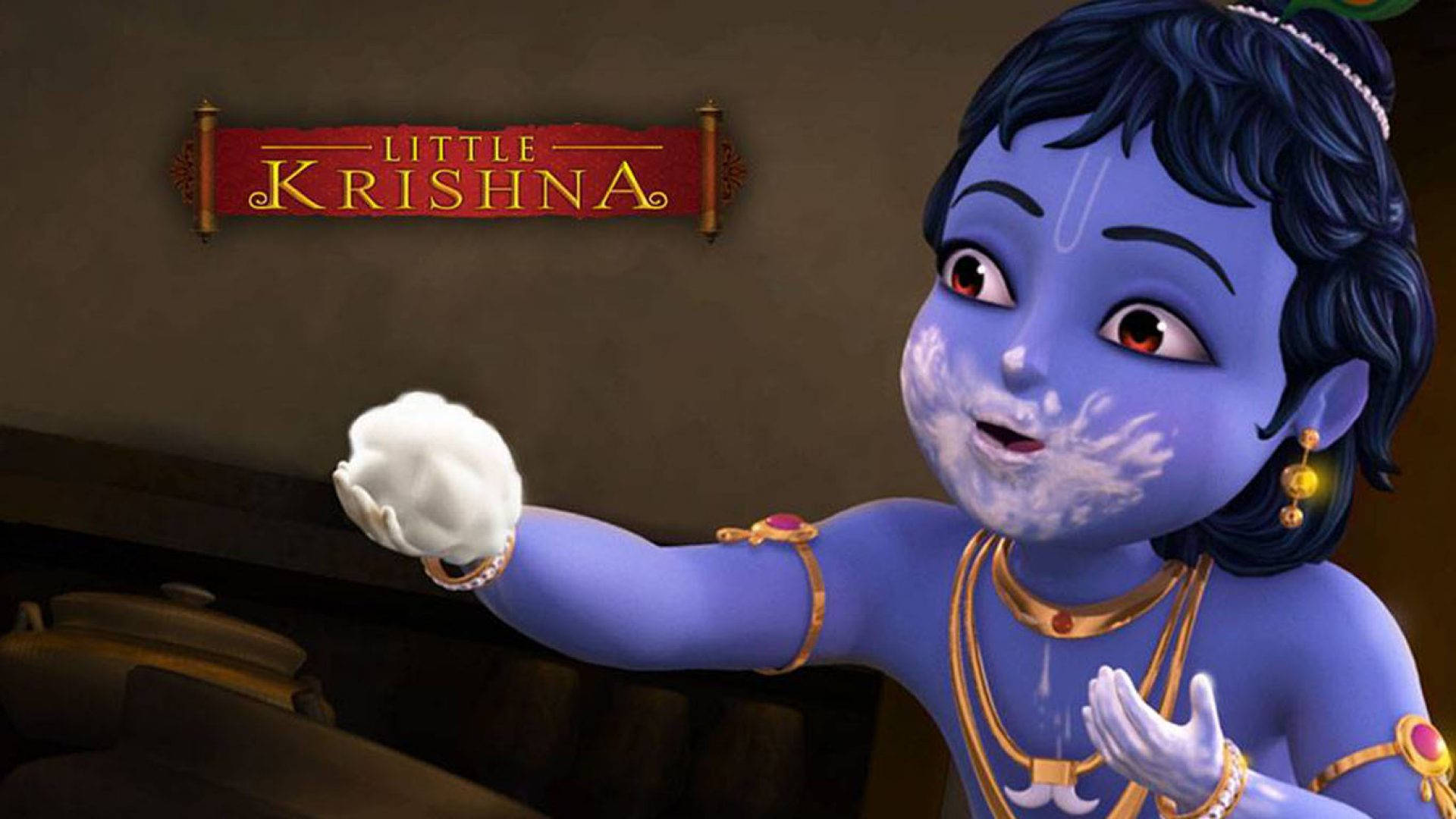 krishna bhagwan 桌布 壁紙 — 一個藍皮膚的動畫小孩，臉上和手上塗著白色顏料，在「小克里希納」標誌下頑皮地做手勢。