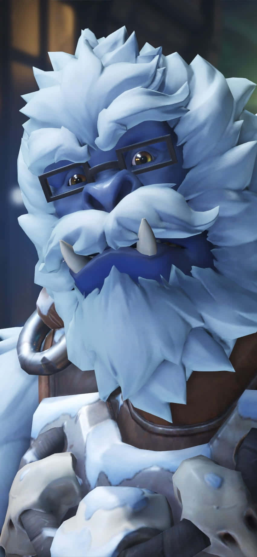 鬥陣特攻 桌布 壁紙 — 一個藍皮膚的雪巨人，擁有冰凍的頭髮和鬍鬚，戴著眼鏡和金屬項圈，背景昏暗。