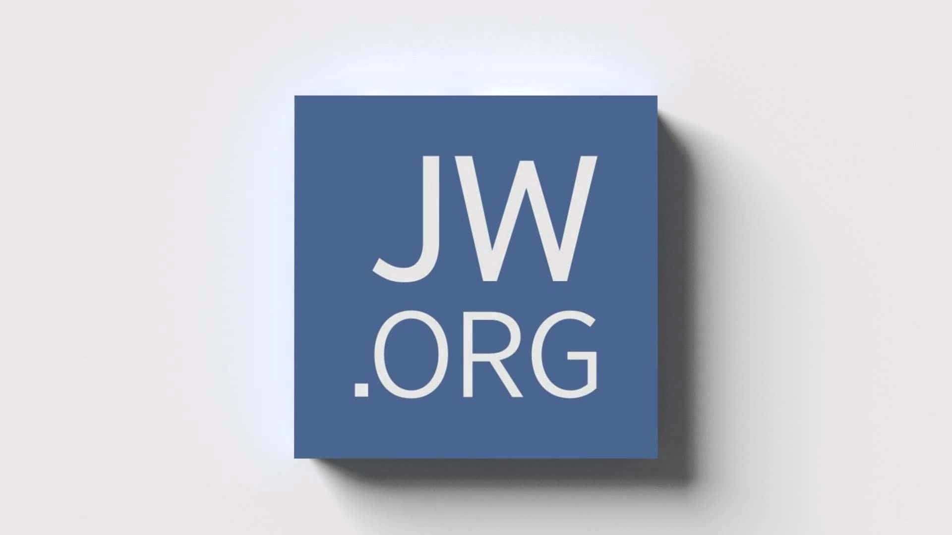 標誌 桌布 壁紙 — 一個藍色正方形標誌，帶有白色JW.ORG文字，在淺灰色牆壁上投射出柔和的陰影。