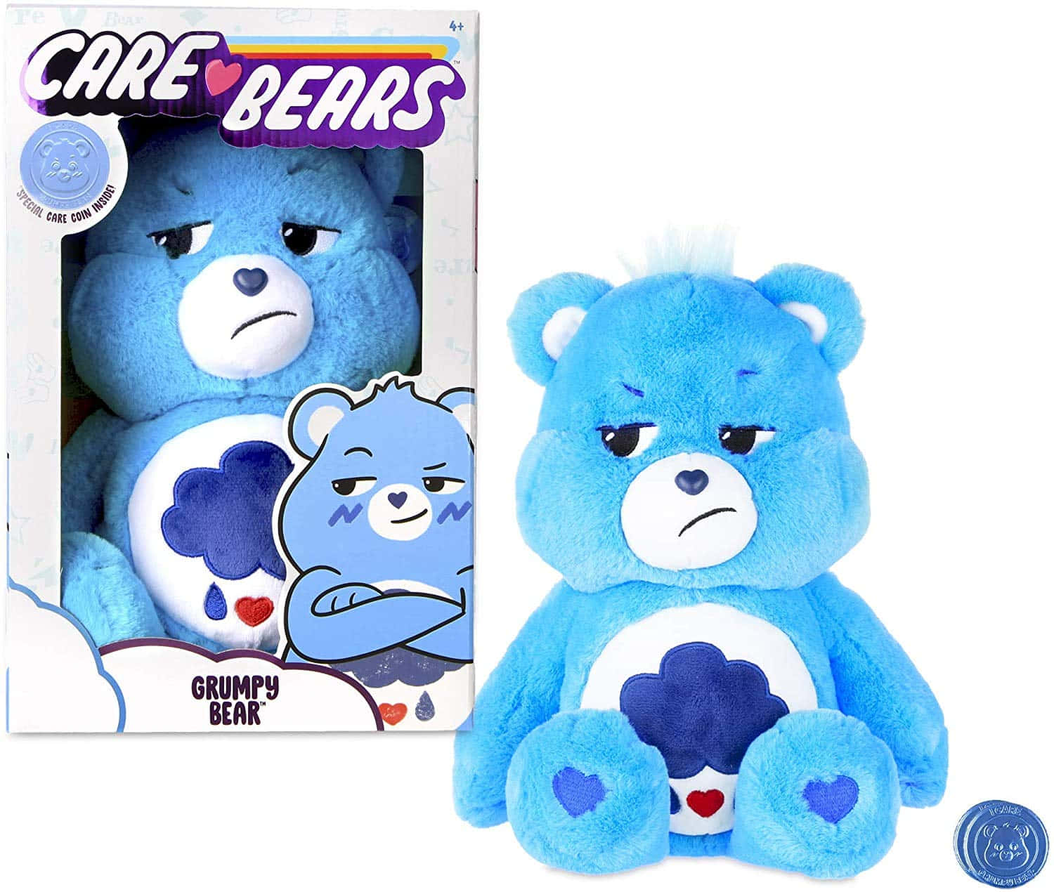 彩虹熊 桌布 壁紙 — 一個藍色毛絨Grumpy Bear玩具放在其彩色盒子旁邊，盒子上顯示同一隻熊，帶有皺眉表情和雲朵標誌。