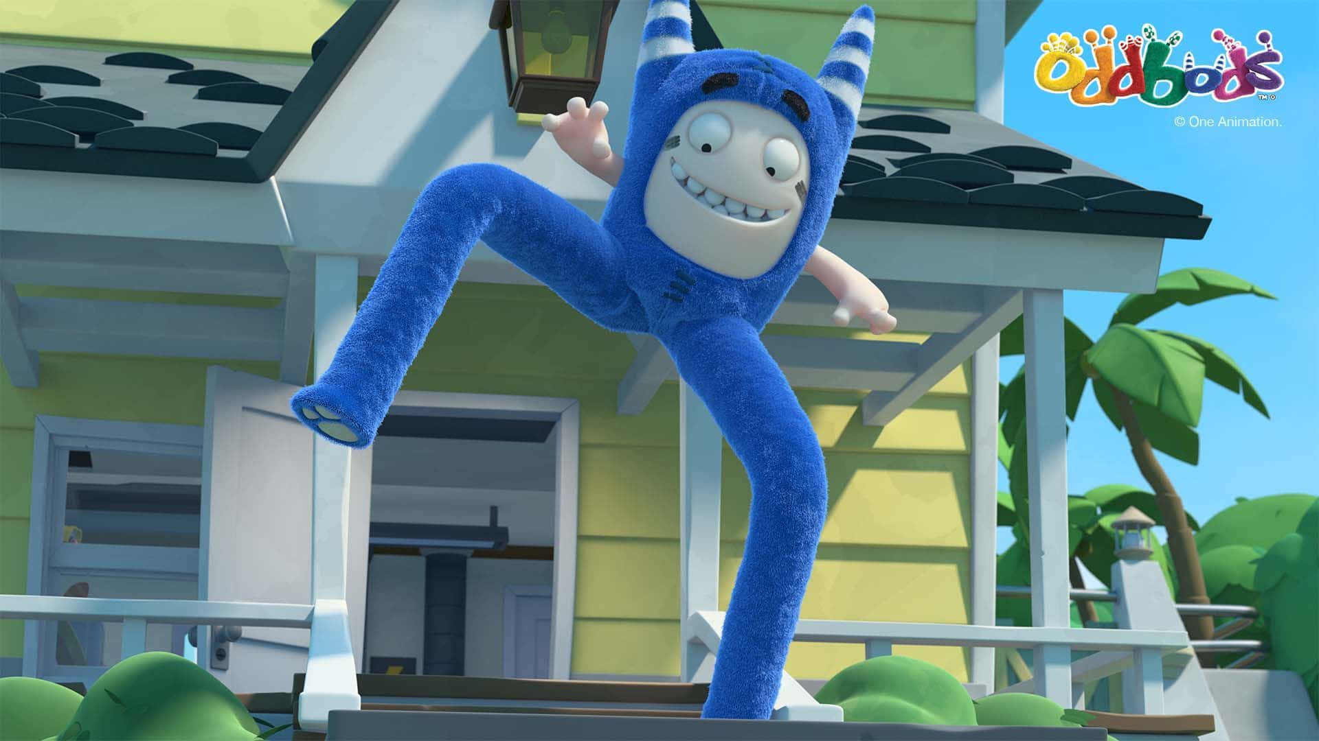 Cartoon Characters 桌布 壁紙 — 一個藍色毛茸茸有角的動畫角色在藍天下黃色房子前的門廊上快樂地跳躍。