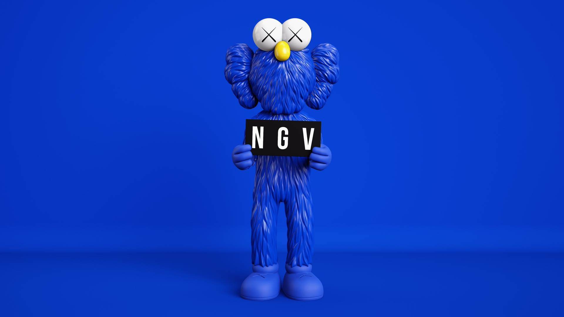KAWS 桌布 壁紙 — 一個藍色毛茸茸的KAWS公仔，雙眼交叉，手持一個黑色標牌，上面寫著NGV，背景是純藍色的工作室背景。
