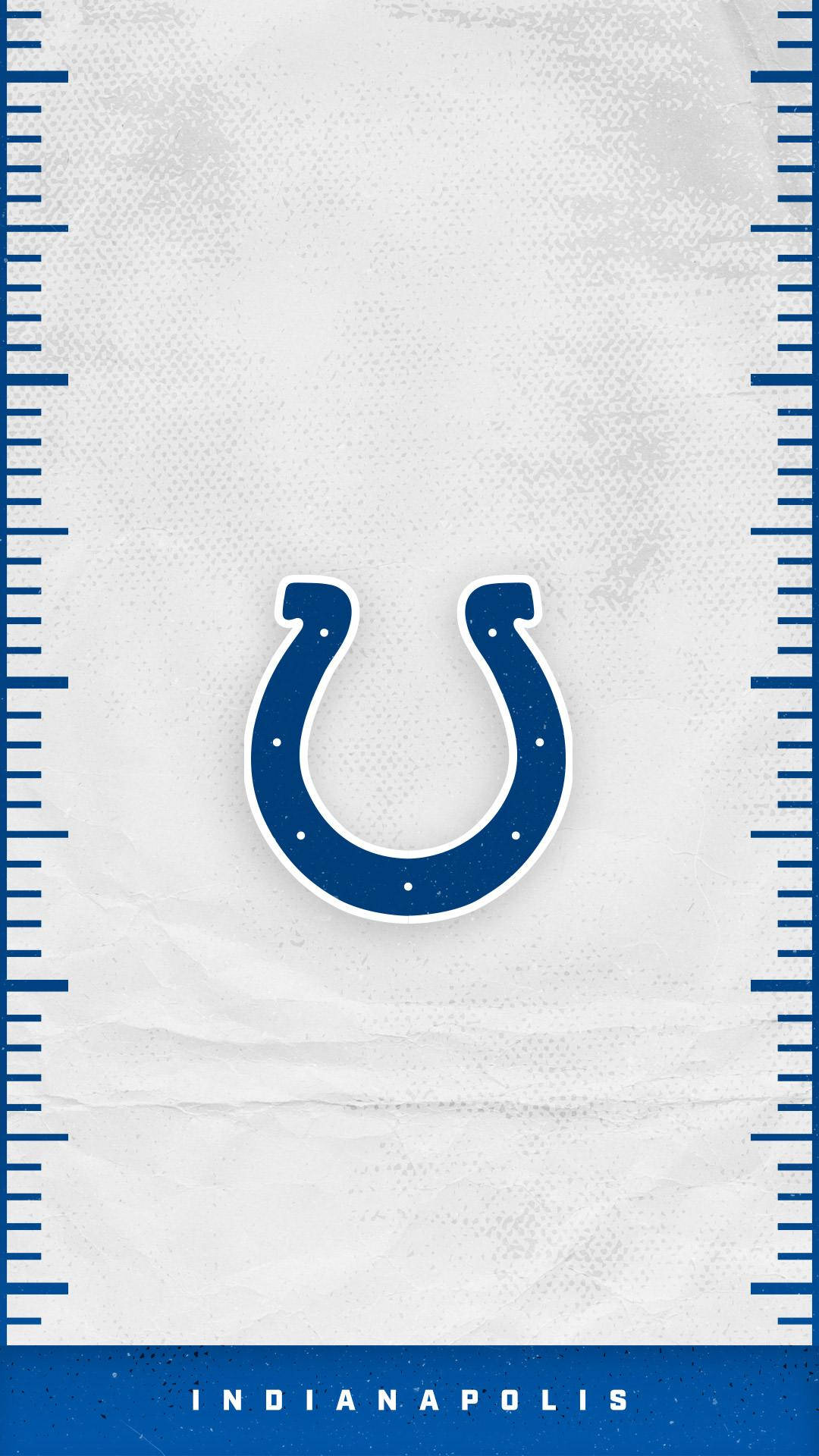 NFL 桌布 壁紙 — 一個藍色馬蹄鐵標誌居中於有紋理的白色背景上，由藍色尺子框住，底部有'INDIANAPOLIS'字樣。